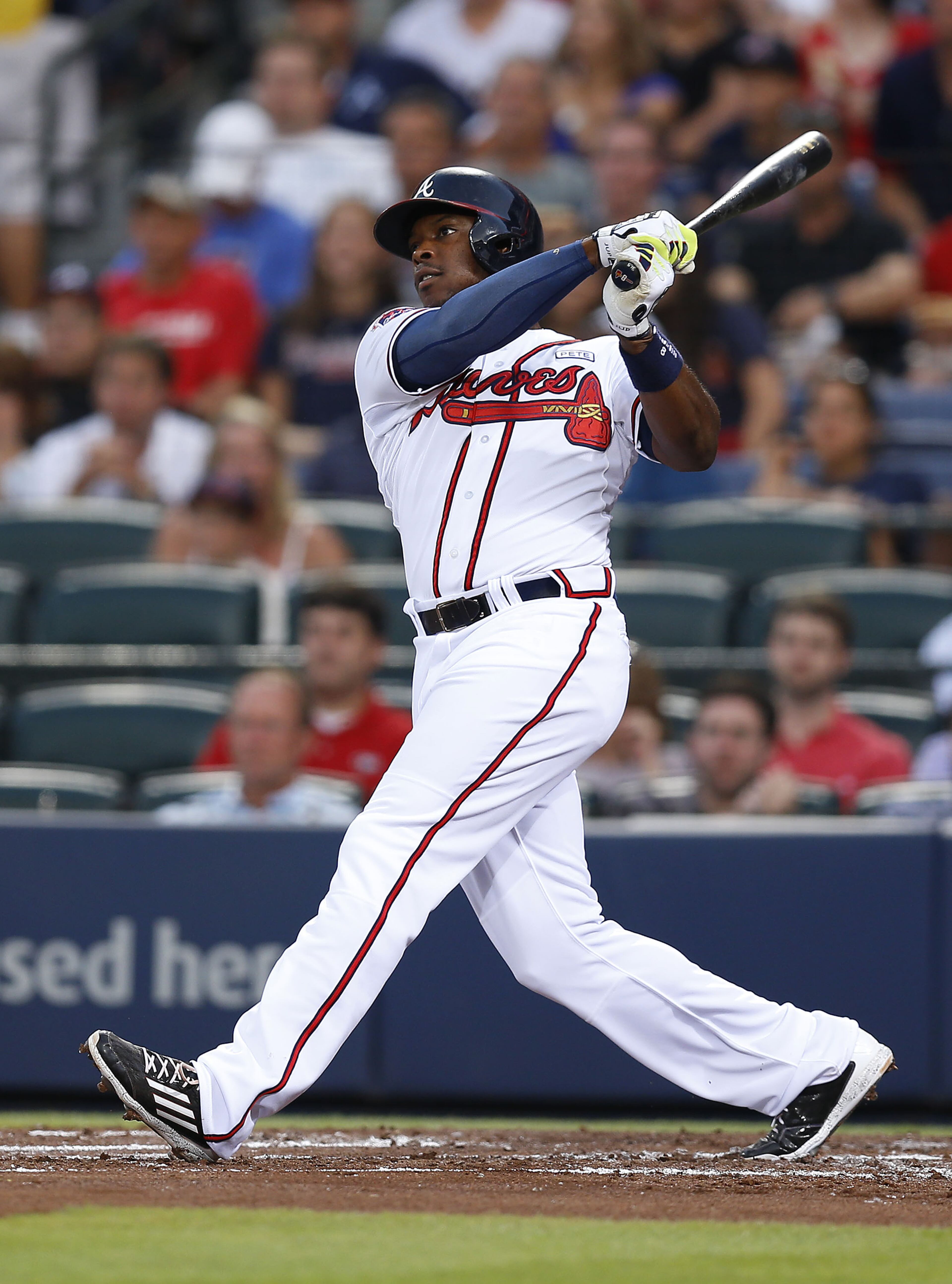 ATLANTA, GA - AUGUST 15: Left fielder Justin Upton #8 of the Atlanta Braves hits a solo home run in the second inning of the game against the Oakland Athletics at Turner Field on August 15, 2014 in Atlanta, Georgia. (Photo by Mike Zarrilli/Getty Images)