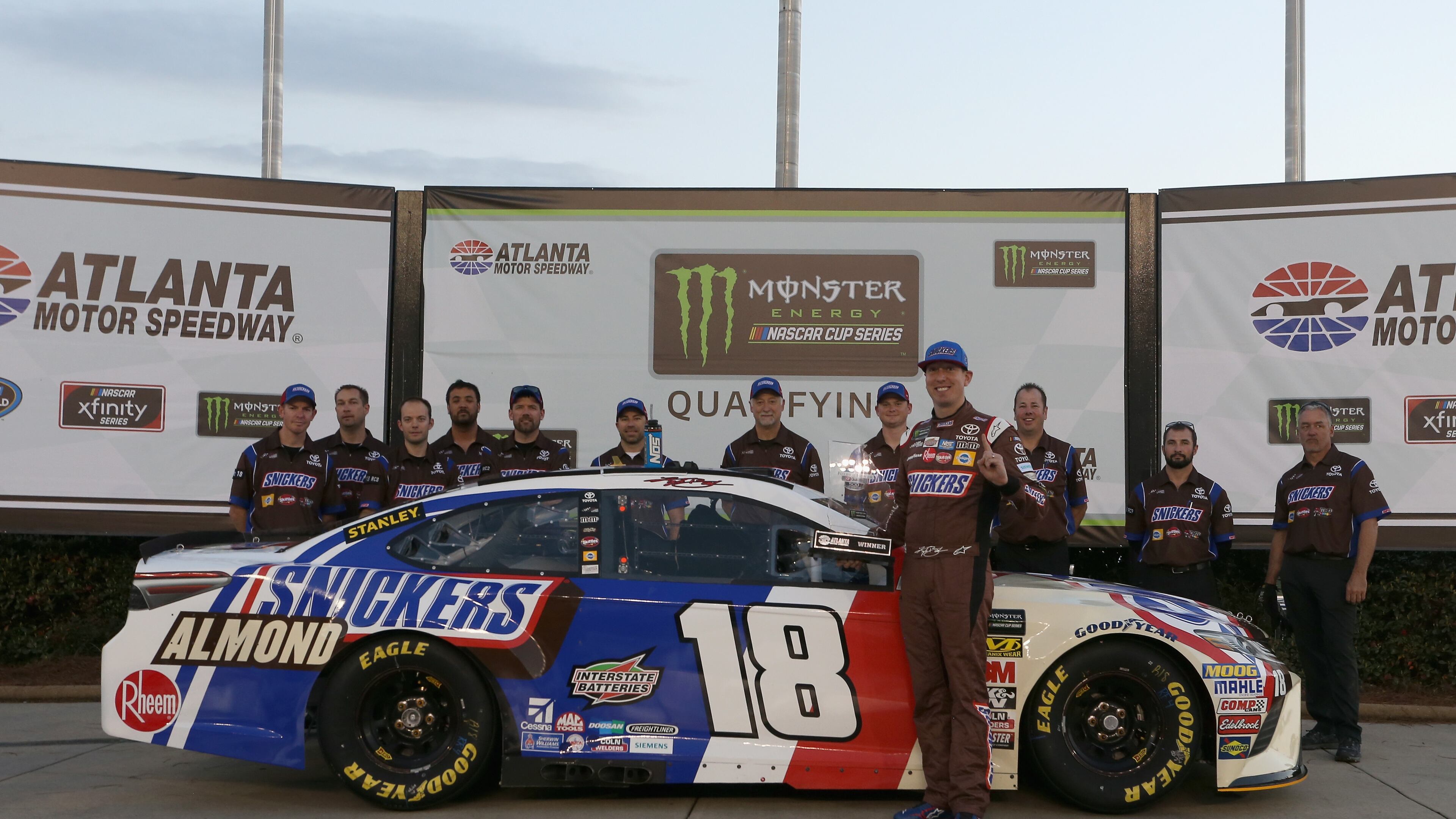 Kyle Busch, driver of the #18 Snickers Almond Toyota, poses with the Pole Award trophy after qualifying for the pole position for the Monster Energy NASCAR Cup Series Folds of Honor QuikTrip 500 at Atlanta Motor Speedway on February 23, 2018 in Hampton, Georgia. (Photo by Brian Lawdermilk/Getty Images)
