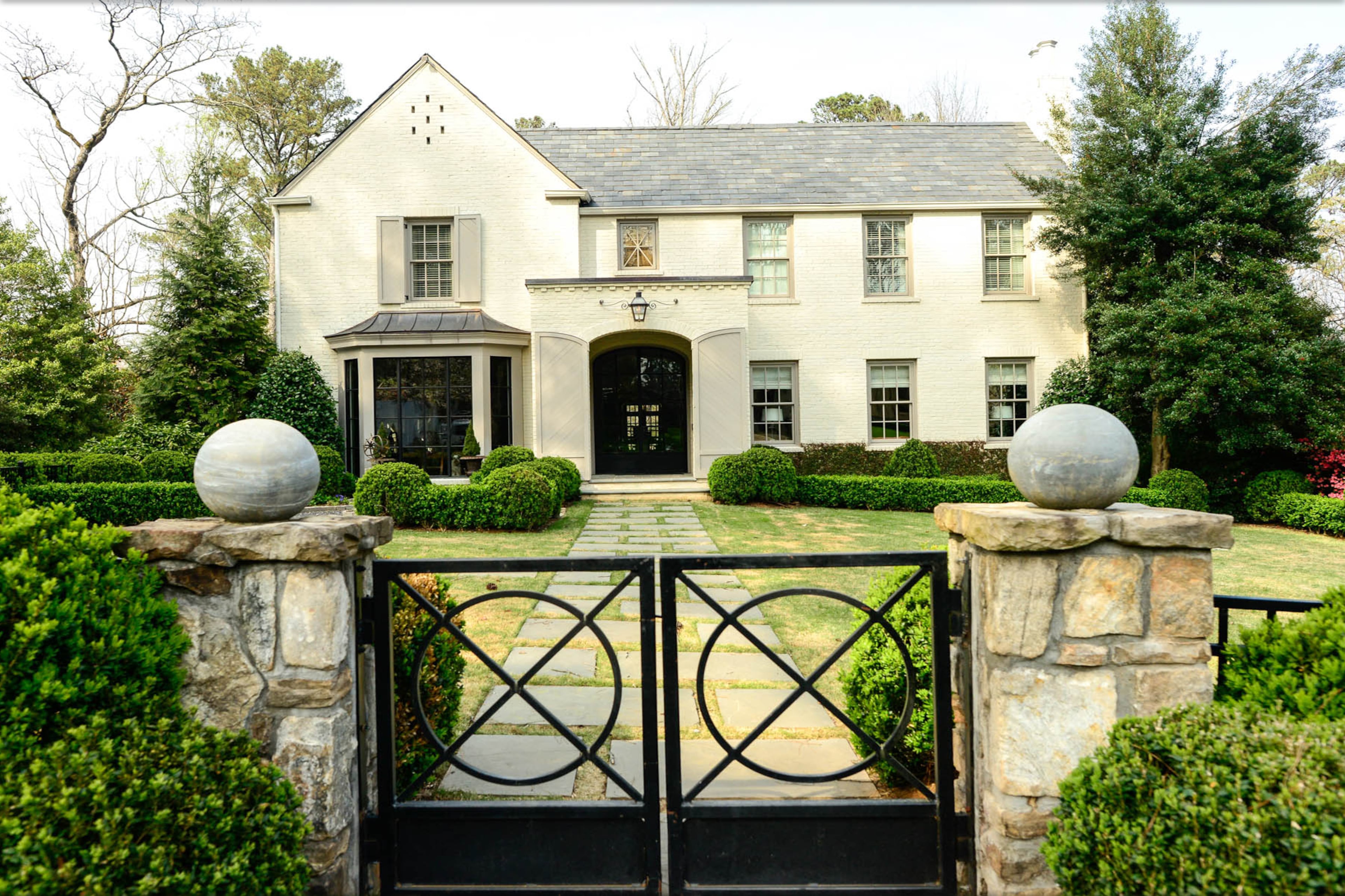 Dina Woodruff's 4,800-square foot home in Atlanta contains four bedrooms and five-and-a-half baths. The Georgian-style house was built in 1934 and has undergone renovations, with the previous owners working with architect D. Stanley Dixon.