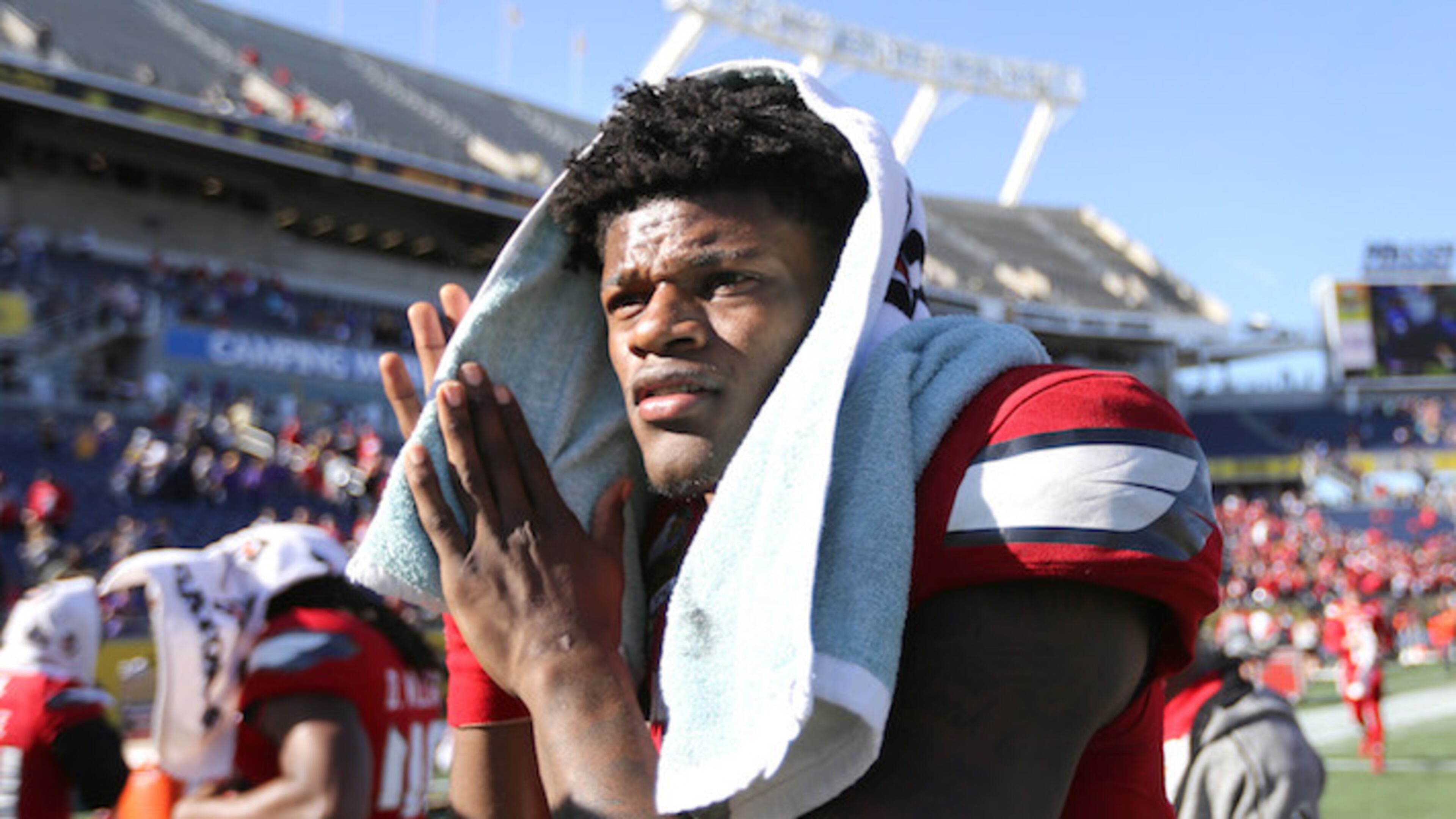 Louisville quarterback and Heisman trophy winner Lamar Jackson leaves the field after a 29-9 loss against LSU in the Buffalo Wild Wings Citrus Bowl at Camping World Stadium in Orlando, Fla., on Saturday, Dec. 31, 2016. (Joe Burbank/Orlando Sentinel/TNS)