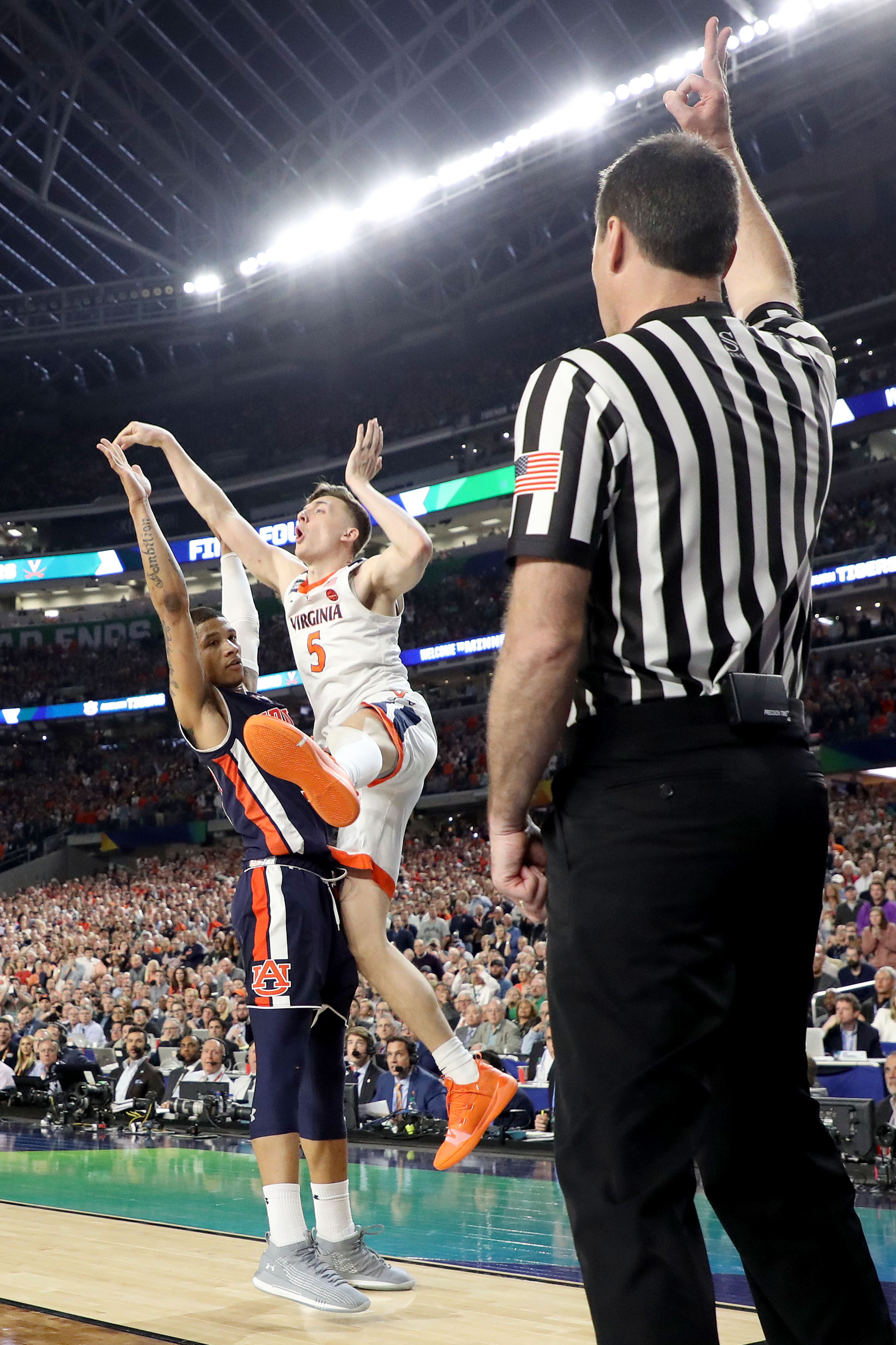 With his team down by two points, Kyle Guy of Virginia attempted a three-pointer as time expired. A foul was called on Auburn's Samir Doughty. Guy made all three free throws and the Cavs advanced to the national championship game. (Photo by Streeter Lecka/Getty Images)