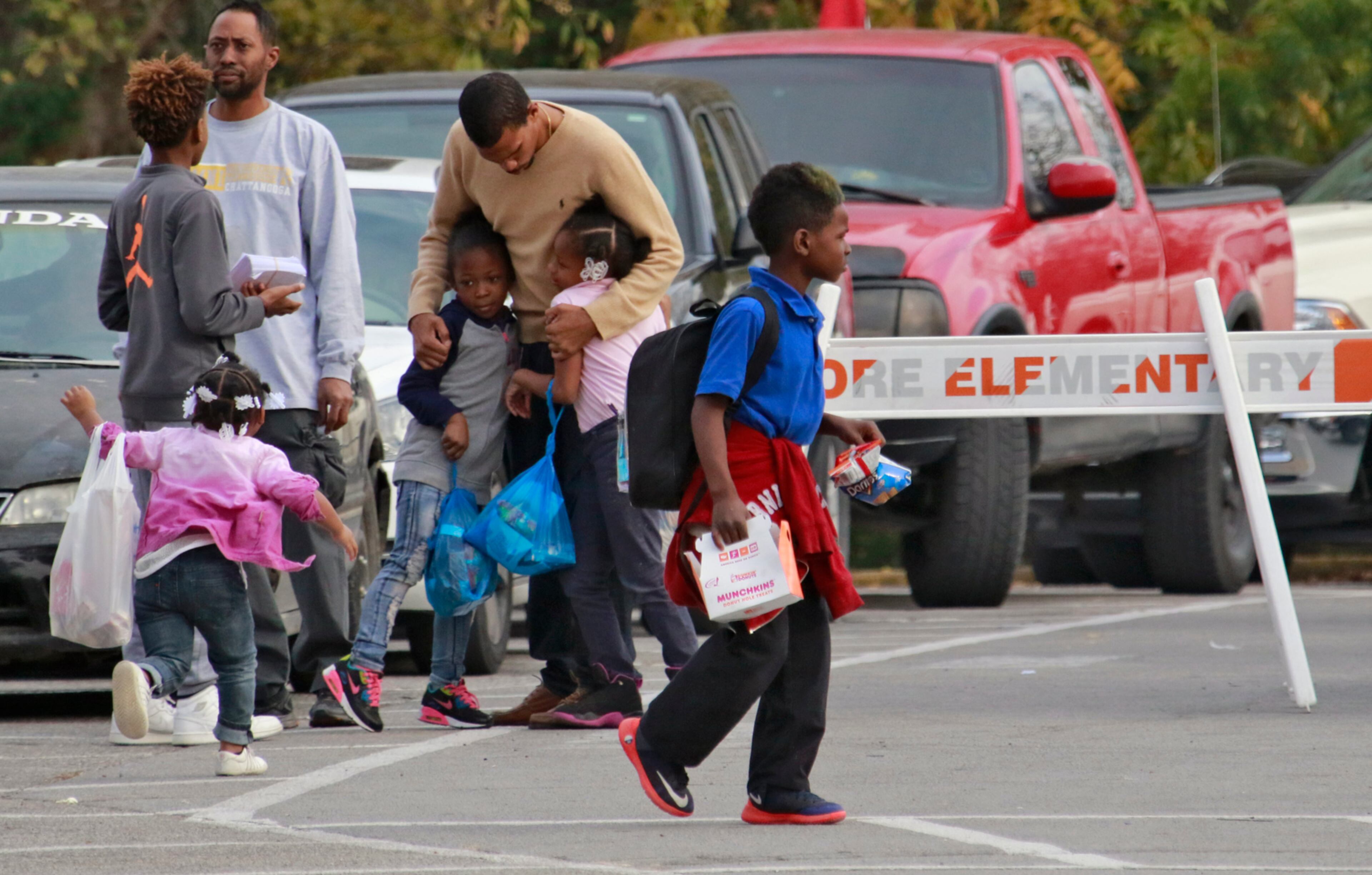 November 22, 2016 - Chattanooga - Some students get hugs as school let out today as school let out. At least five children died days before Thanksgiving in a horrific crash in Chattanooga. Bus driver Johnthony Walker, 24, has been charged with five counts of vehicular homicide, reckless endangerment and reckless driving, the Chattanooga Police Department said. BOB ANDRES /BANDRES@AJC.COM