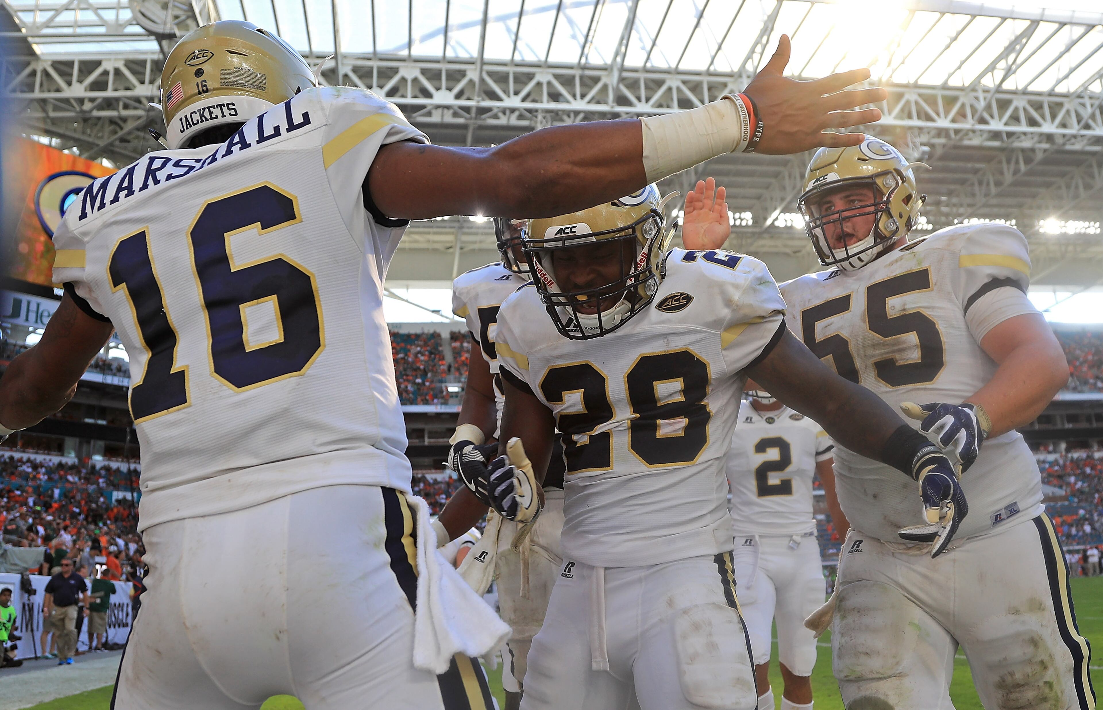J.J. Green and TaQuon Marshall celebrate a touchdown during Saturday's game in Miami Gardens, Florida. (Photo by Mike Ehrmann/Getty Images)