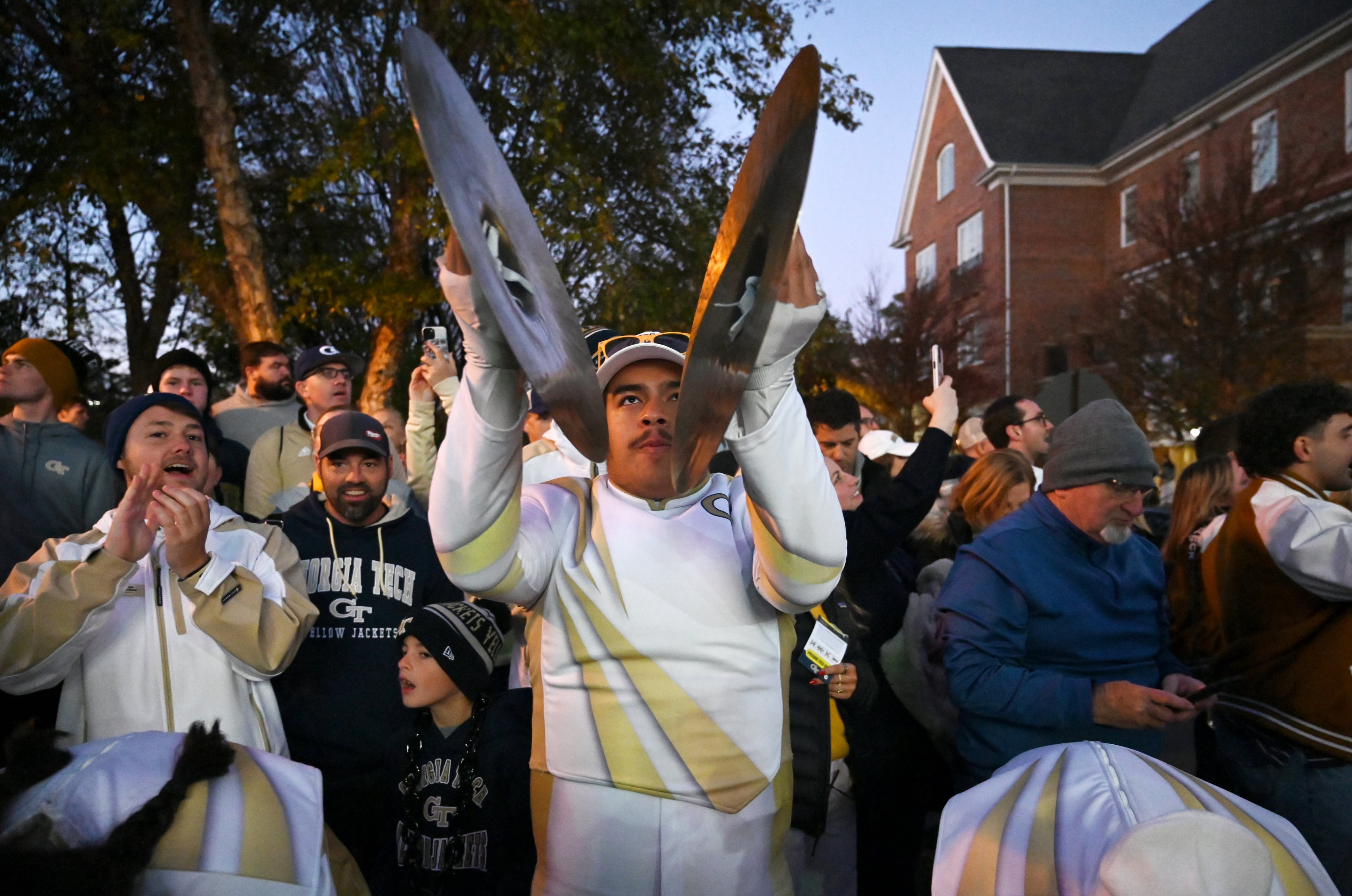 Georgia Tech marching band members perform as players and coaching staff arrive prior to an NCAA college football game between Georgia Tech and North Carolina State at Bobby Dodd Stadium, Thursday, November 21, 2024, in Atlanta. (Hyosub Shin / AJC)