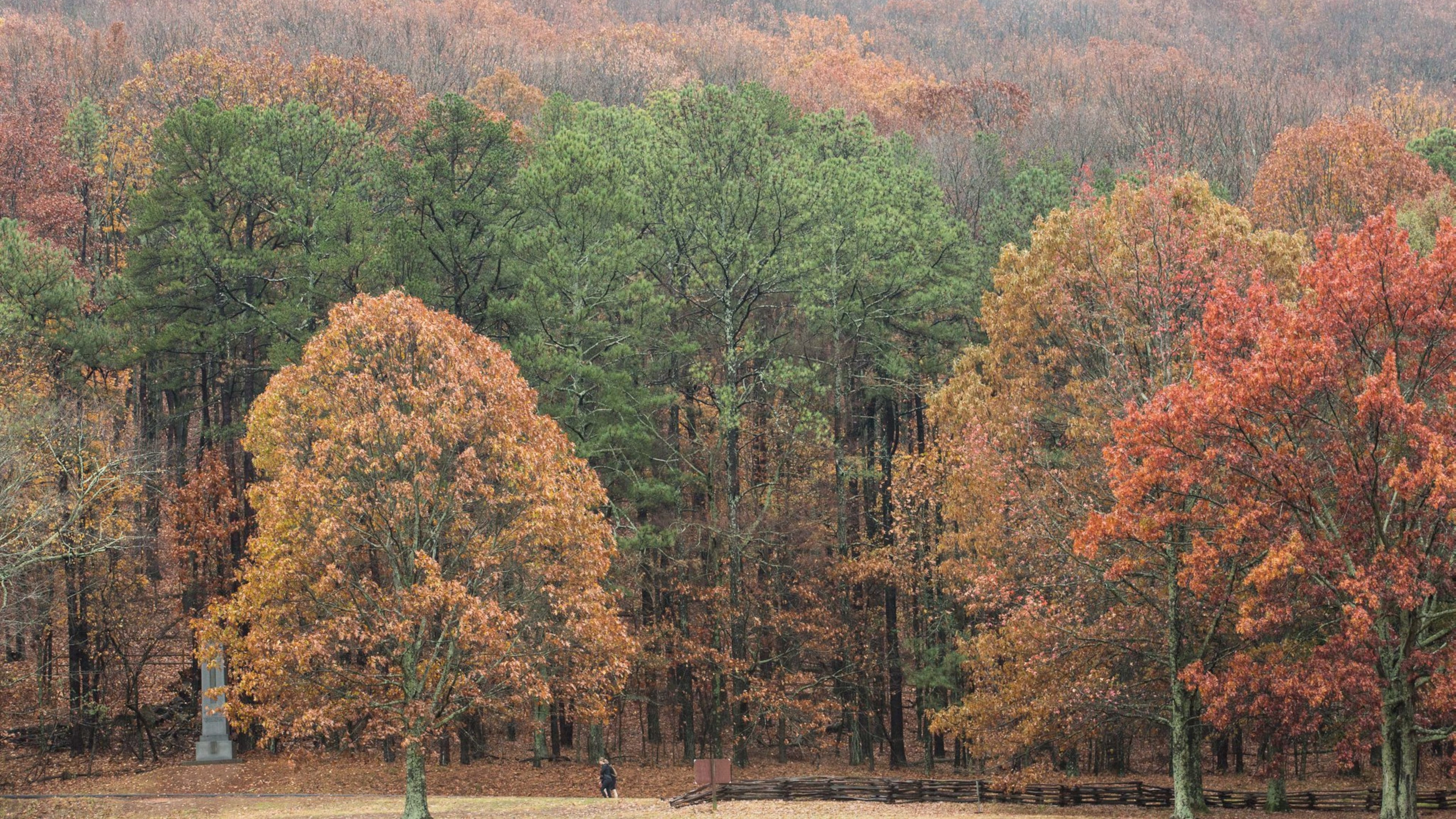 Two people walk at the base of Kennesaw Mountain on an overcast day, Tuesday, Dec. 6, 2016, in Kennesaw, Ga. Branden Camp/Special