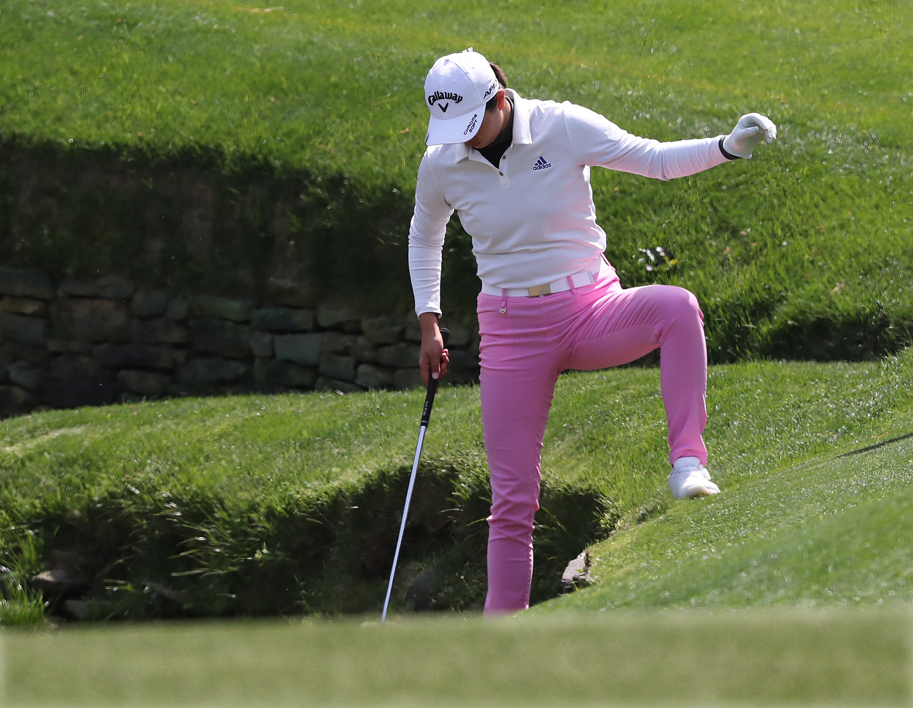 Early leader Rose Zhang hit her second shot into a tributary to Rays Creek at the 13th green where she made a triple bogey in the Augusta National Women’s Amateur final round on Saturday, April 3, 2021, in Augusta. Zhang missed a playoff with Tsubasa Kajitani and Emilia Migliaccio by one stroke. “Curtis Compton / Curtis.Compton@ajc.com”