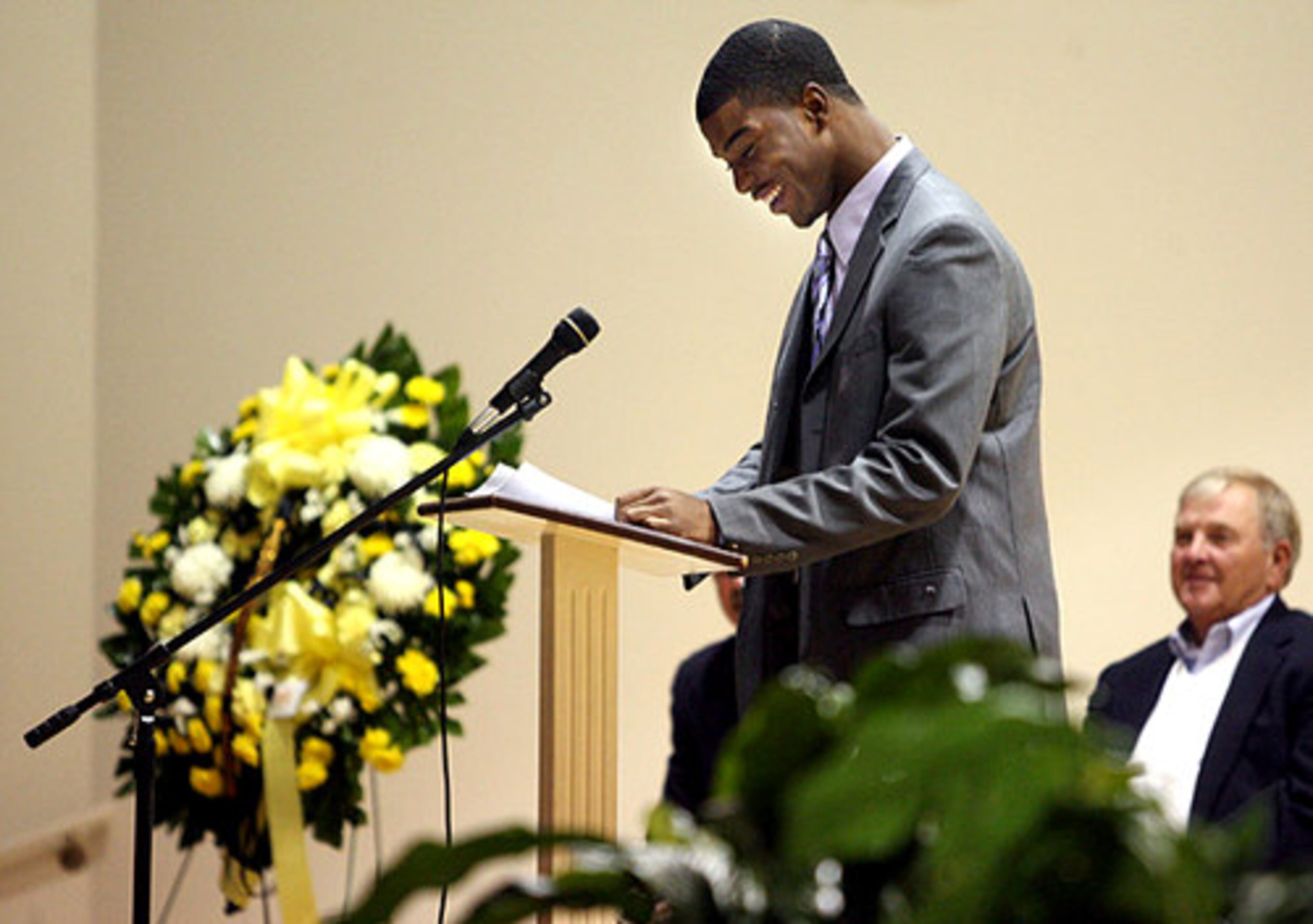 Central Gwinnett senior linebacker Javis Williams delivers an emotional testimonial of his former coach. Dennis Roland died of cancer earlier in the week.