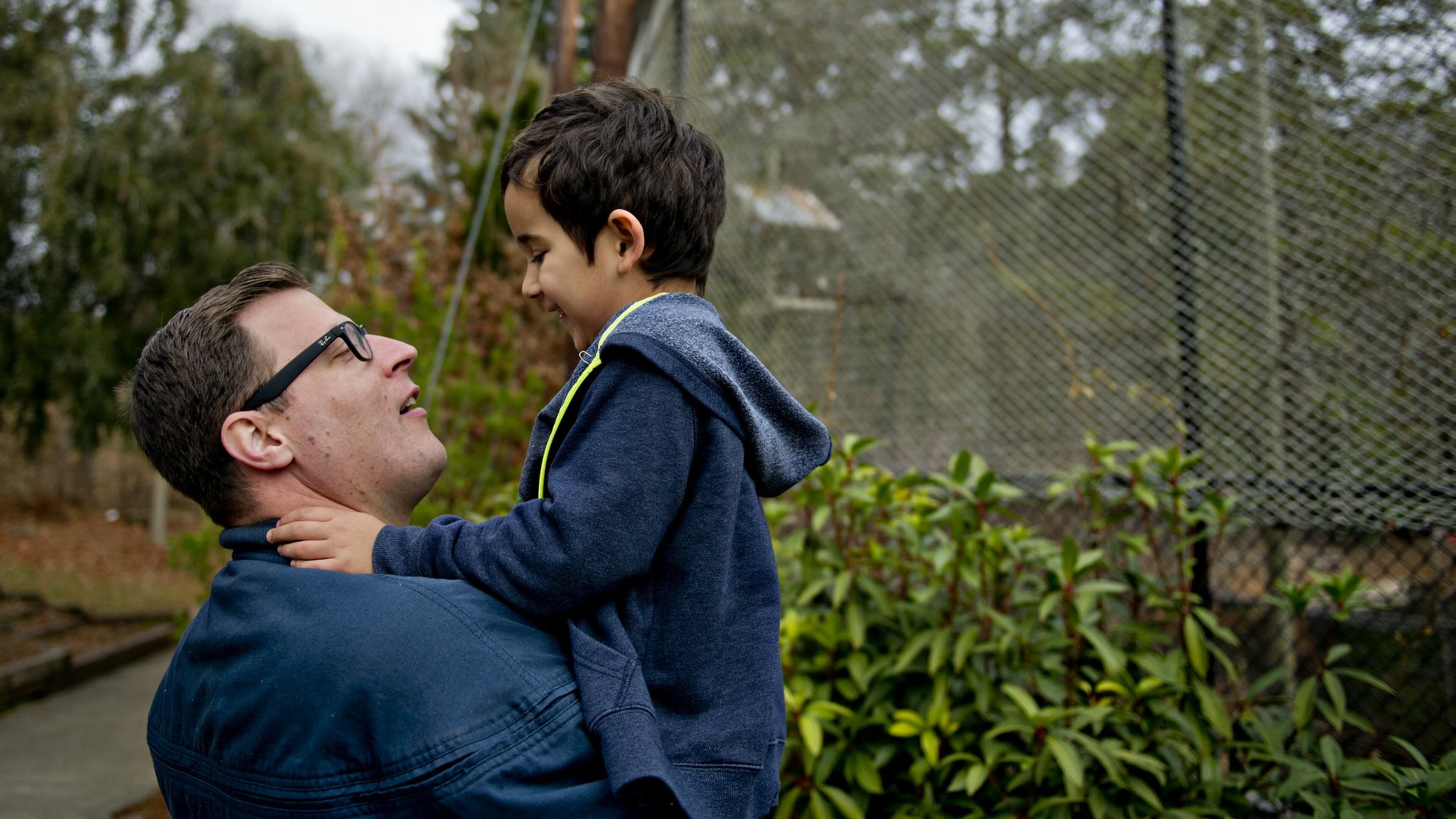 Scott Raisor (left) holds his son Maine so he can get a better look at a pair of bald eagles at the Chattahoochee Nature Center in Roswell. JONATHAN PHILLIPS / SPECIAL