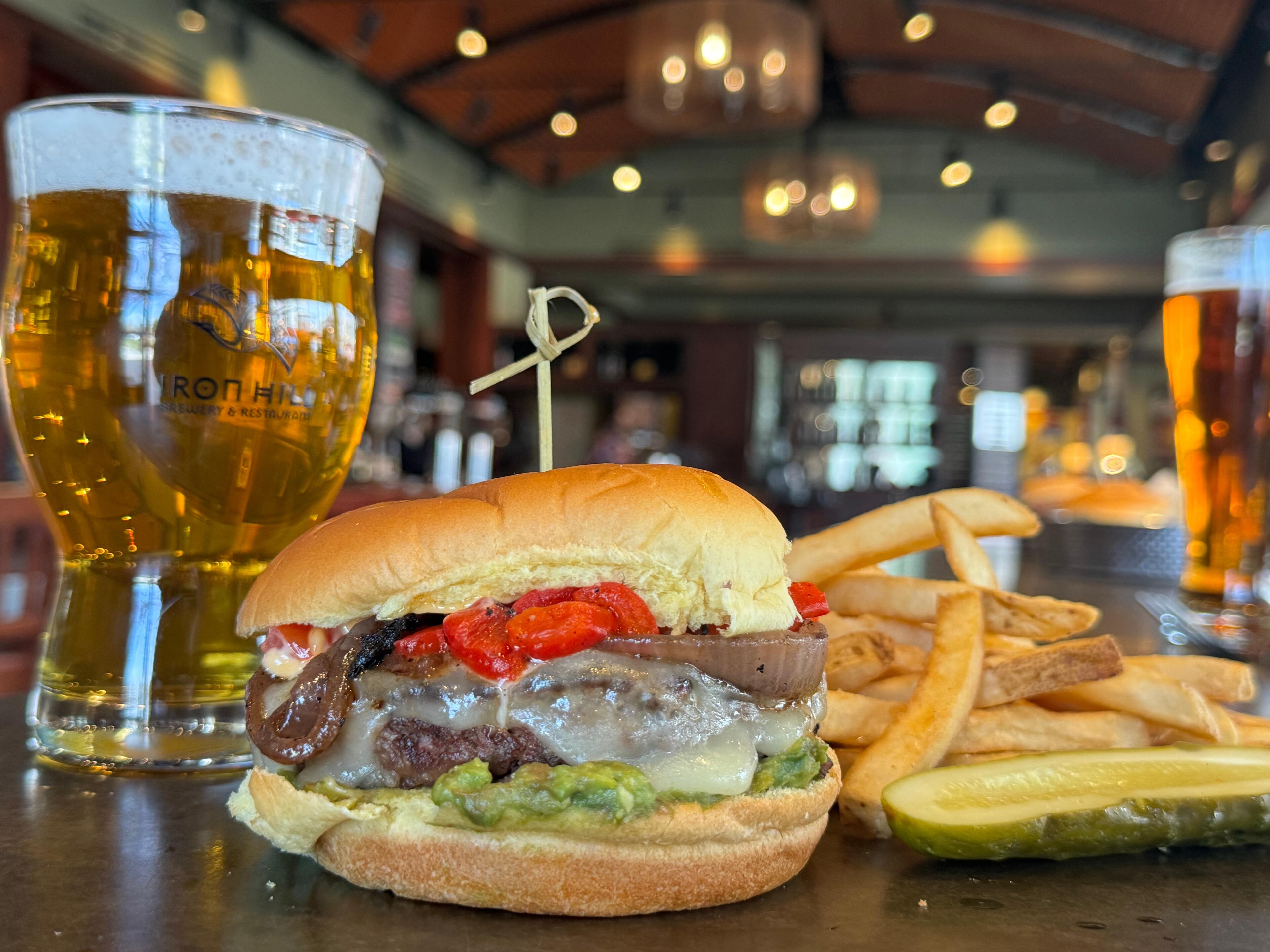 Iron Hill Brewery will feature a new burger each day for National Burger Month. Burgers cost $15 and come with fries and a pickle. (Courtesy of Iron Hill Brewery)