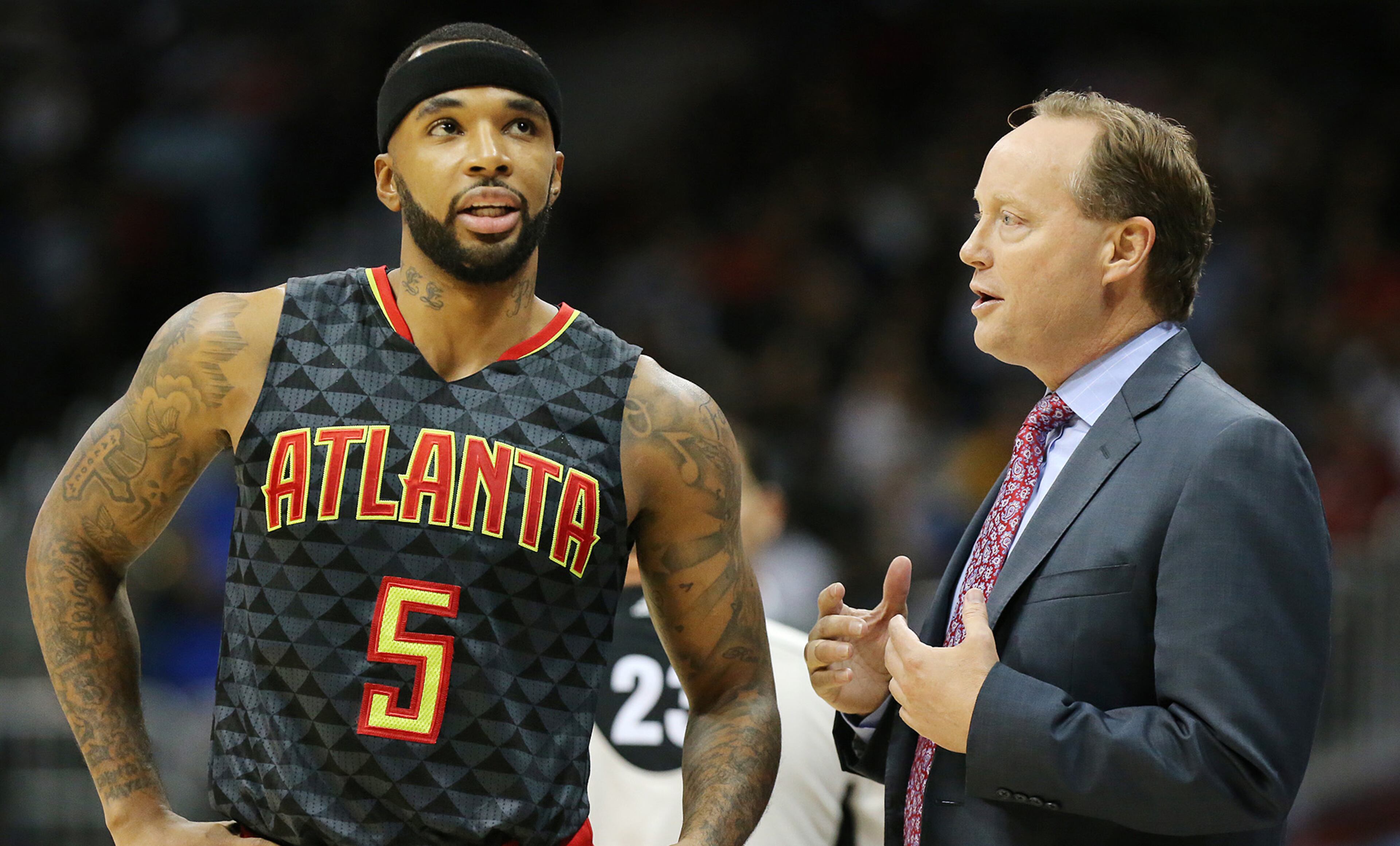 November 2, 2016, ATLANTA: Hawks head coach Mike Budenholzer confers with Malcolm Delaney during the first period against the Lakers in an NBA basketball game at Philips Arena on Wednesday, Nov. 2, 2016, in Atlanta. Curtis Compton /ccompton@ajc.com