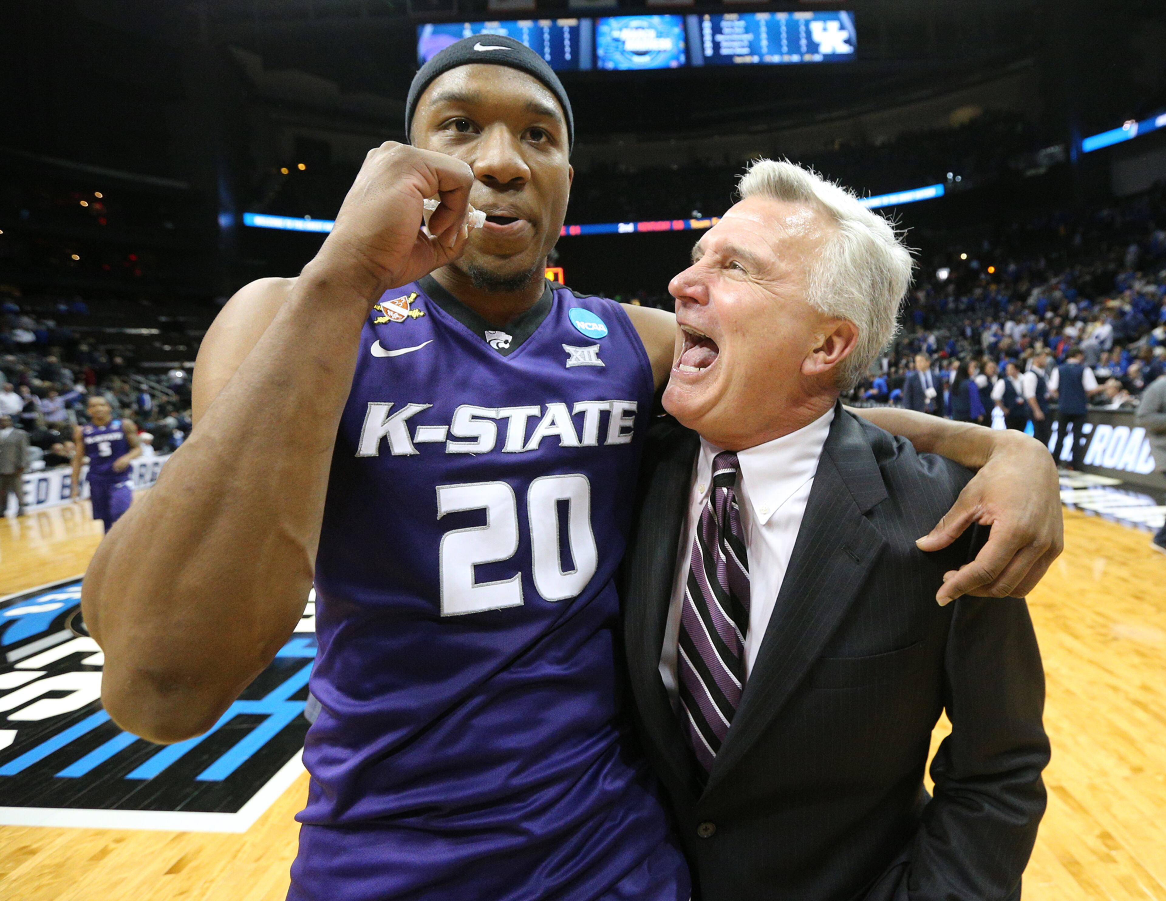 March 23, 2018 Atlanta: Kansas State head coach Bruce Weber and forward Xavier Sneed celebrate beating Kentucky 61-58 in a regional semifinal NCAA college basketball game early Friday, March 23, 2018, in Atlanta. Curtis Compton/ccompton@ajc.com