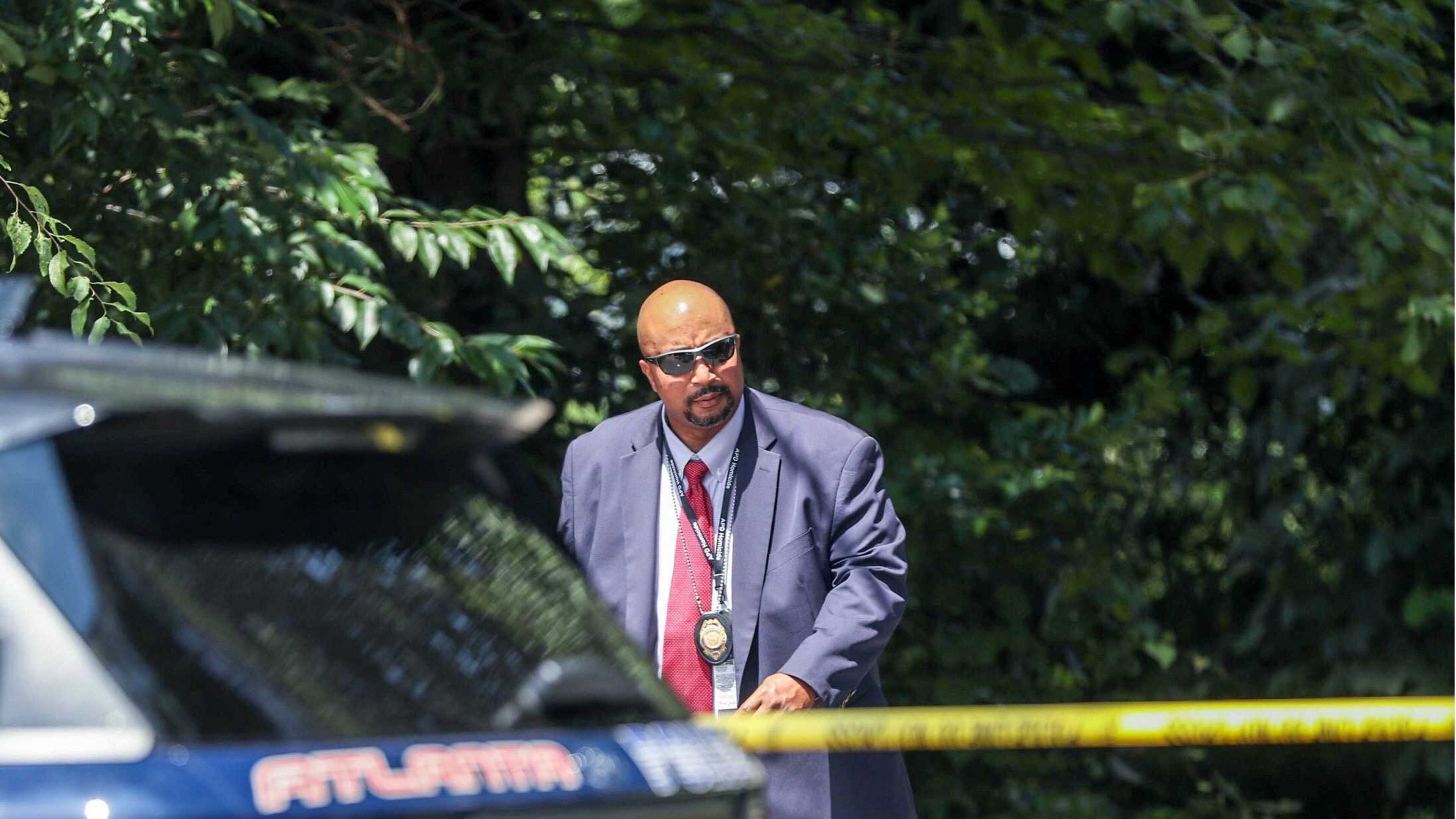 Members of the Atlanta Police Department investigate a scene at the corner of Lakewood Avenue and Terrace Way in southeast Atlanta’s Lakewood Heights community, where police discovered the body of a woman who had been reported kidnapped hours earlier.