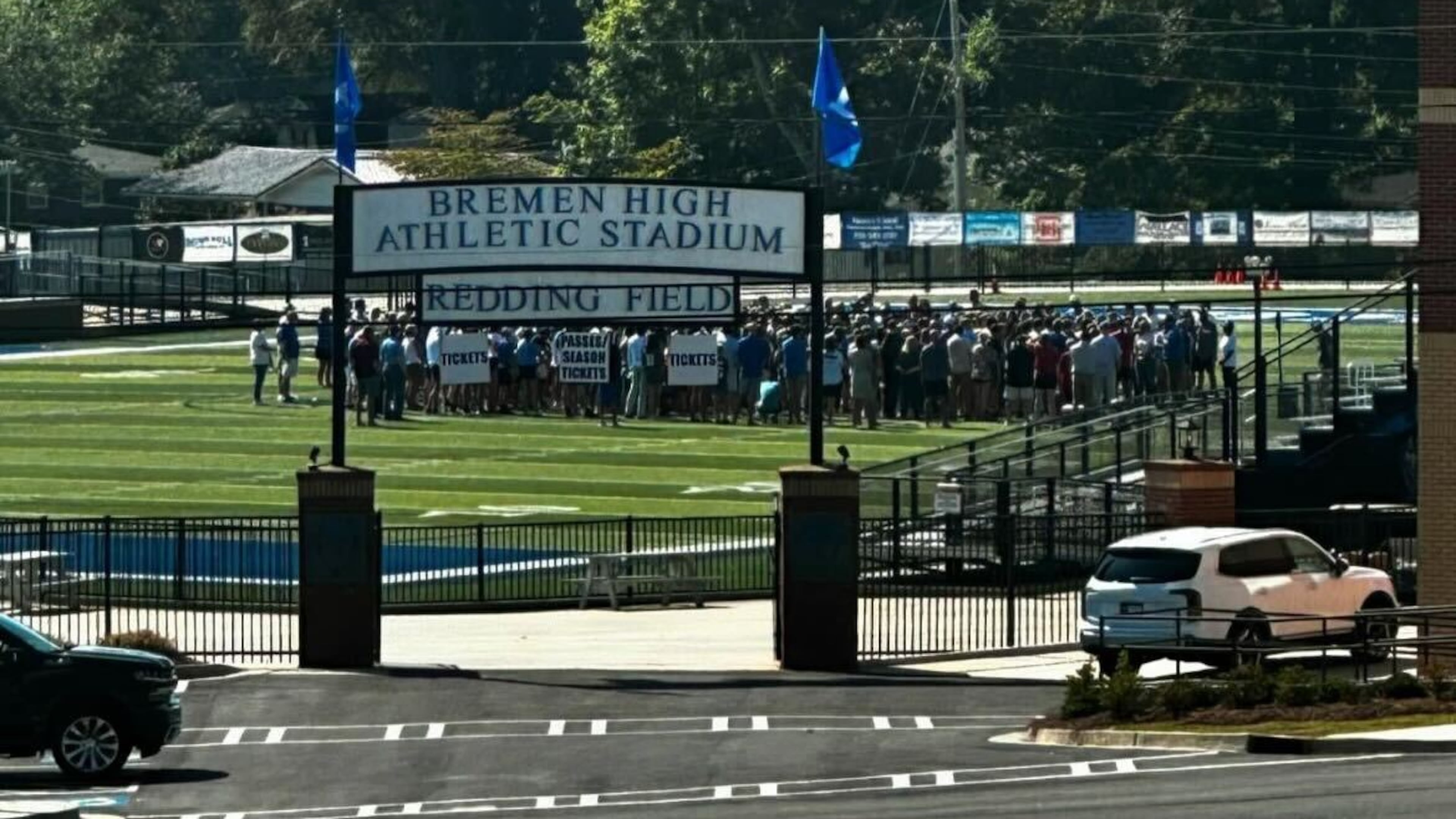 Community members gather on the football field at Bremen High School to pray for Carson Kimball.