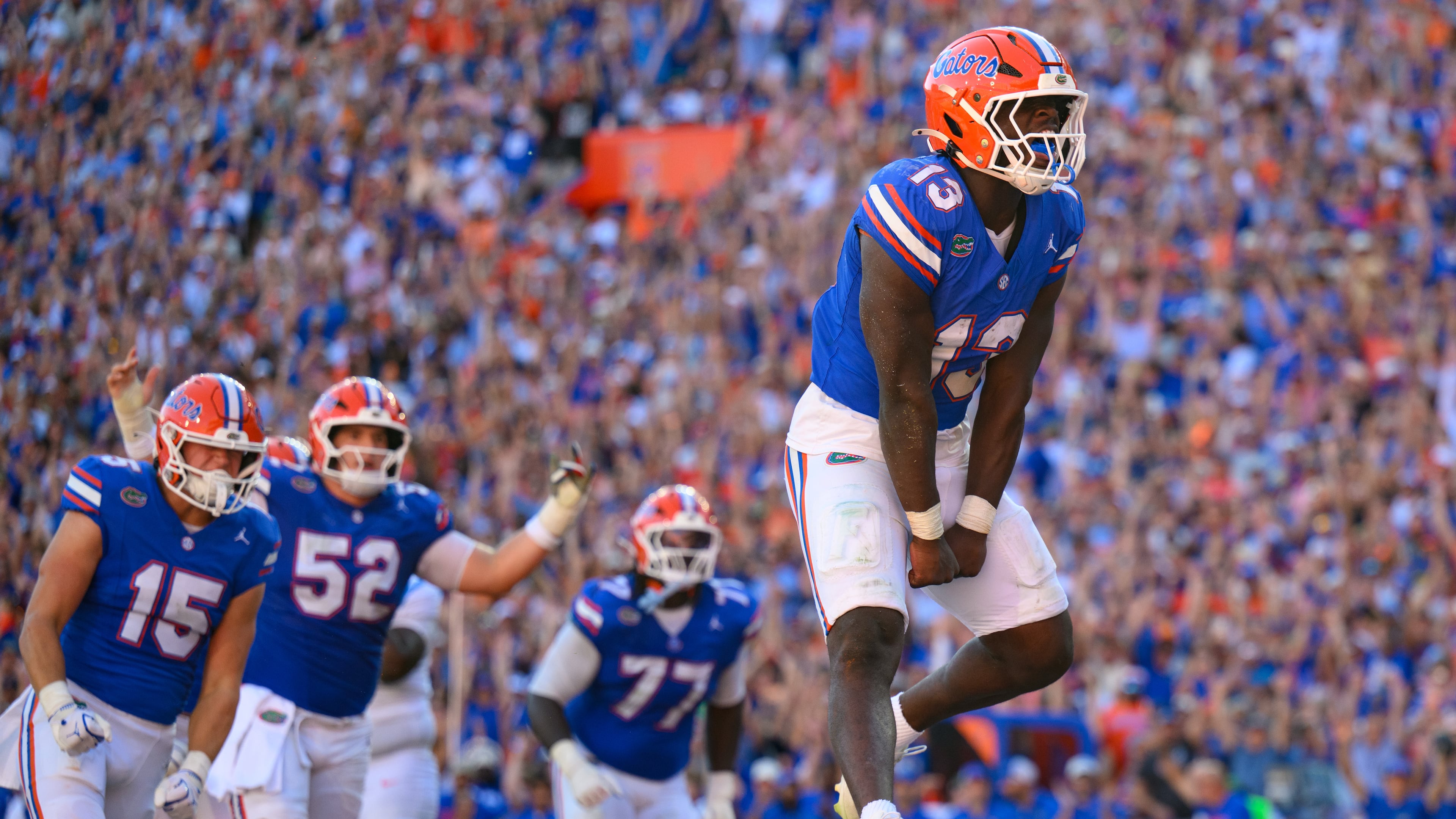 Florida running back Jadan Baugh (13) jumps in celebration after rushing for a touchdown during the first half of an NCAA college football game against Mississippi, Saturday, Sept. 26, 2026, in Gainesville, Fla. (AP Photo/Noah Lantor)