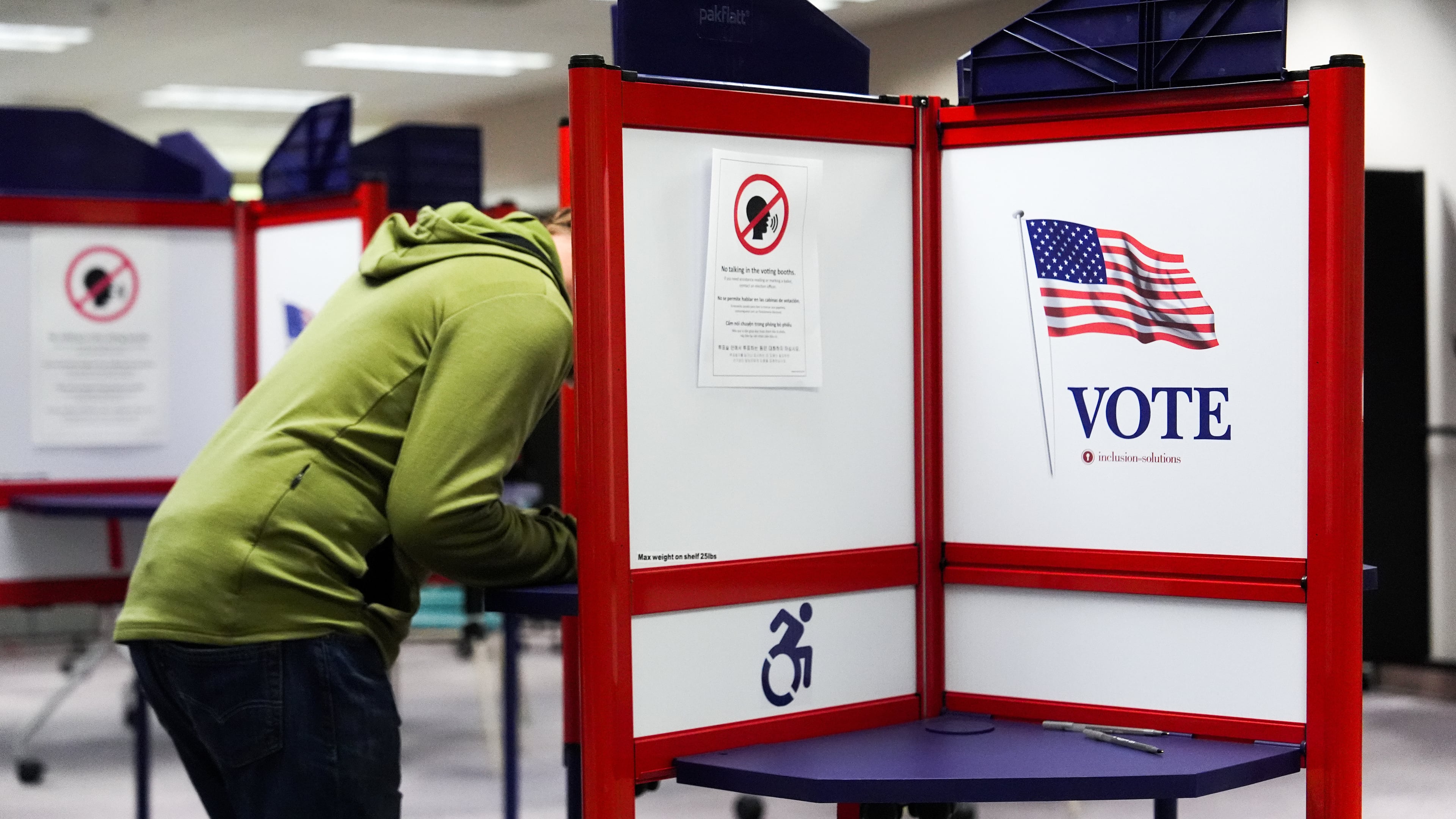 A person votes early in the Virginia redistricting referendum at the Fairfax County Government Center, Friday, April 3, 2026, in Fairfax, Va. (AP Photo/Julia Demaree Nikhinson)