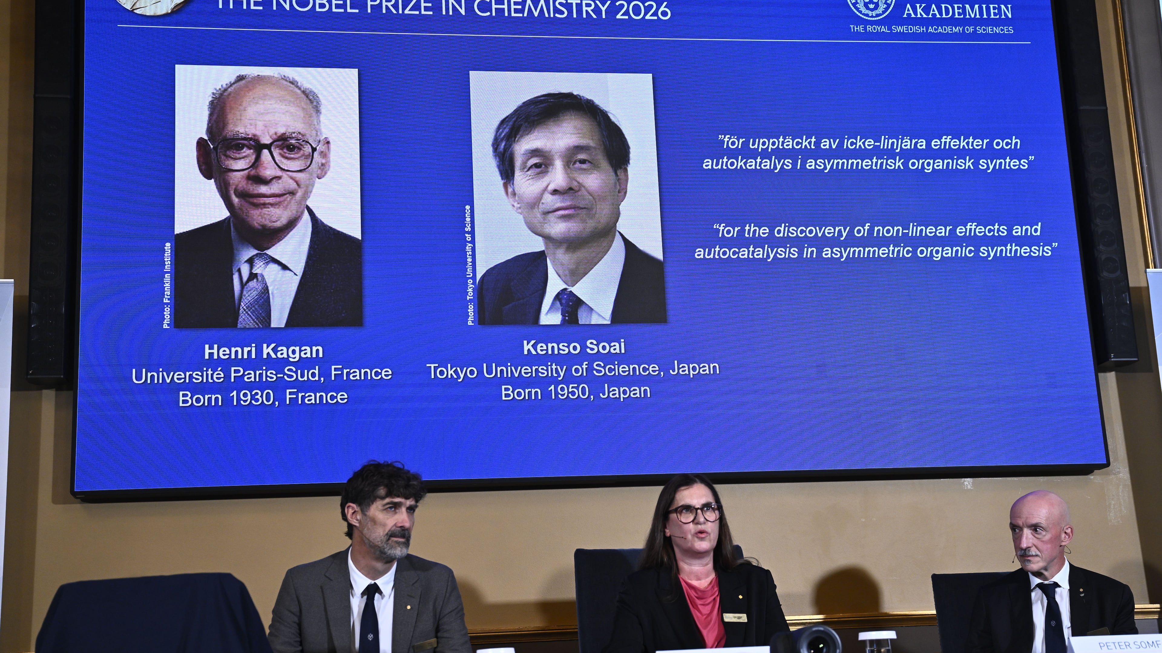 Portraits of Henri Kagan and Kenso Soai are shown on the screen as they are awarded the 2026 Nobel Prize in Chemistry, at the Royal Swedish Academy of Sciences in Stockholm, Sweden, on Oct. 7, 2026. Photo: (Fredrik Sandberg/TT News Agency via AP)