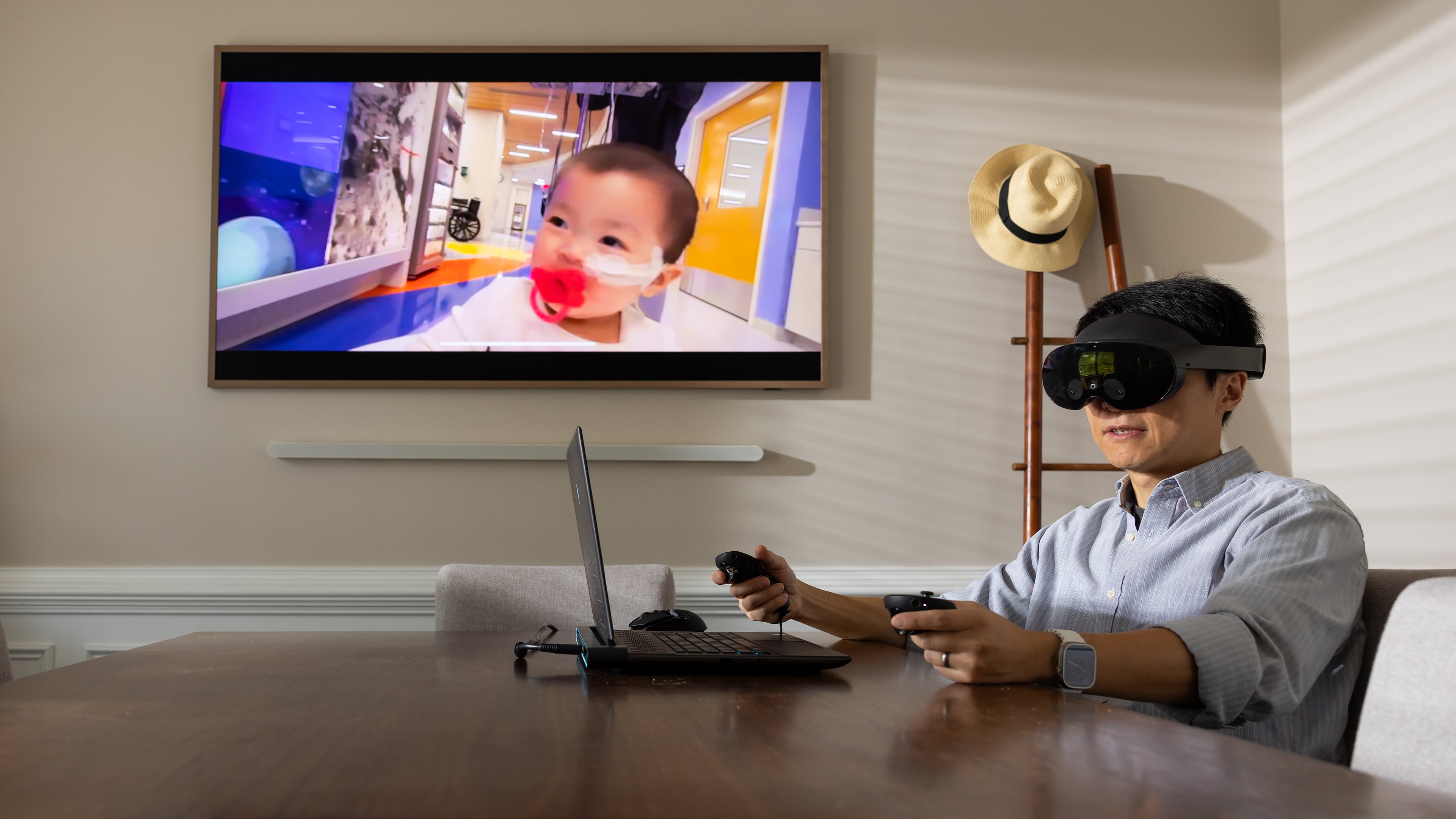 Kennesaw State University assistant professor of game development Lei Zhang presents his latest project. The virtual reality system is designed to aid parents in grief therapy. (Courtesy of Matt Yung/Kennesaw State University)