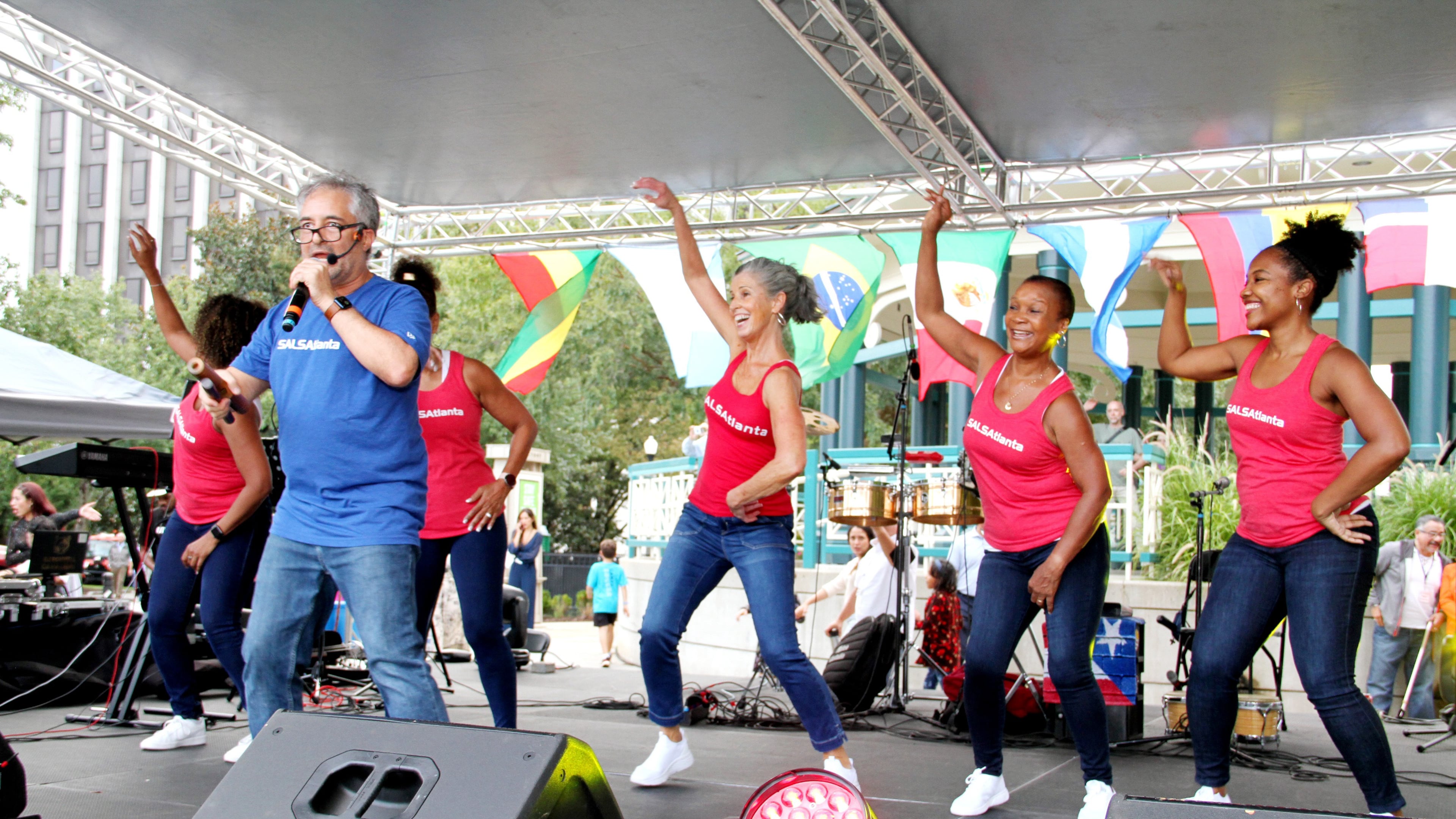 When Julian Meija (pictured in blue), founder of SALSAtlanta, first moved to Atlanta in the 1990s, he found no one was dancing casino as they had been in Miami. He introduced Atlantans to the Cuban form and has been teaching it ever since. (Courtesy of Julian Mejia Photography)