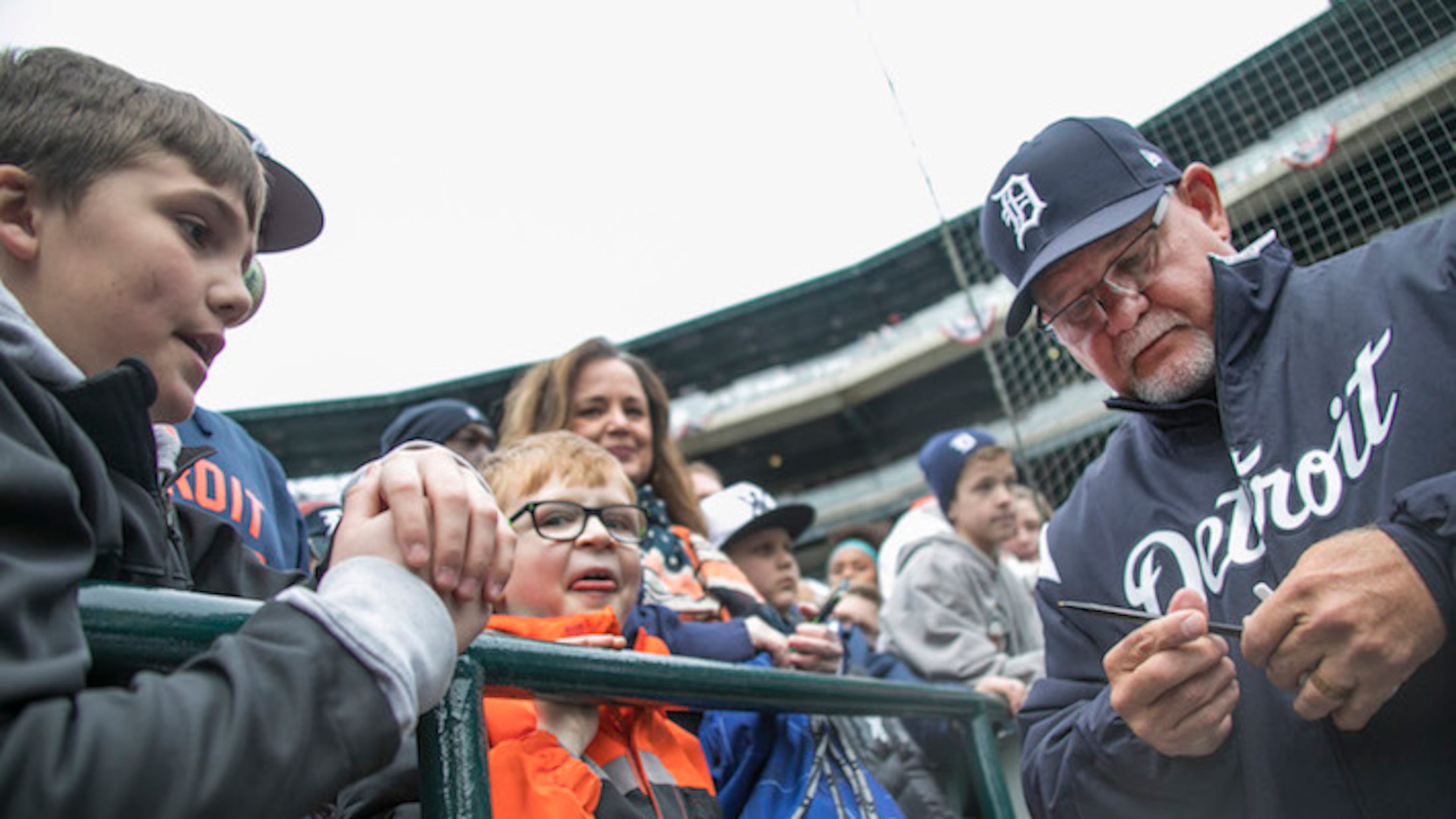 Detroit Tigers manager Ron Gardenhire, right, signs autographs before action against the Pittsburgh Pirates at Comerica Park in Detroit on Friday, March 30, 2018. (Mandi Wright/Detroit Free Press/TNS)