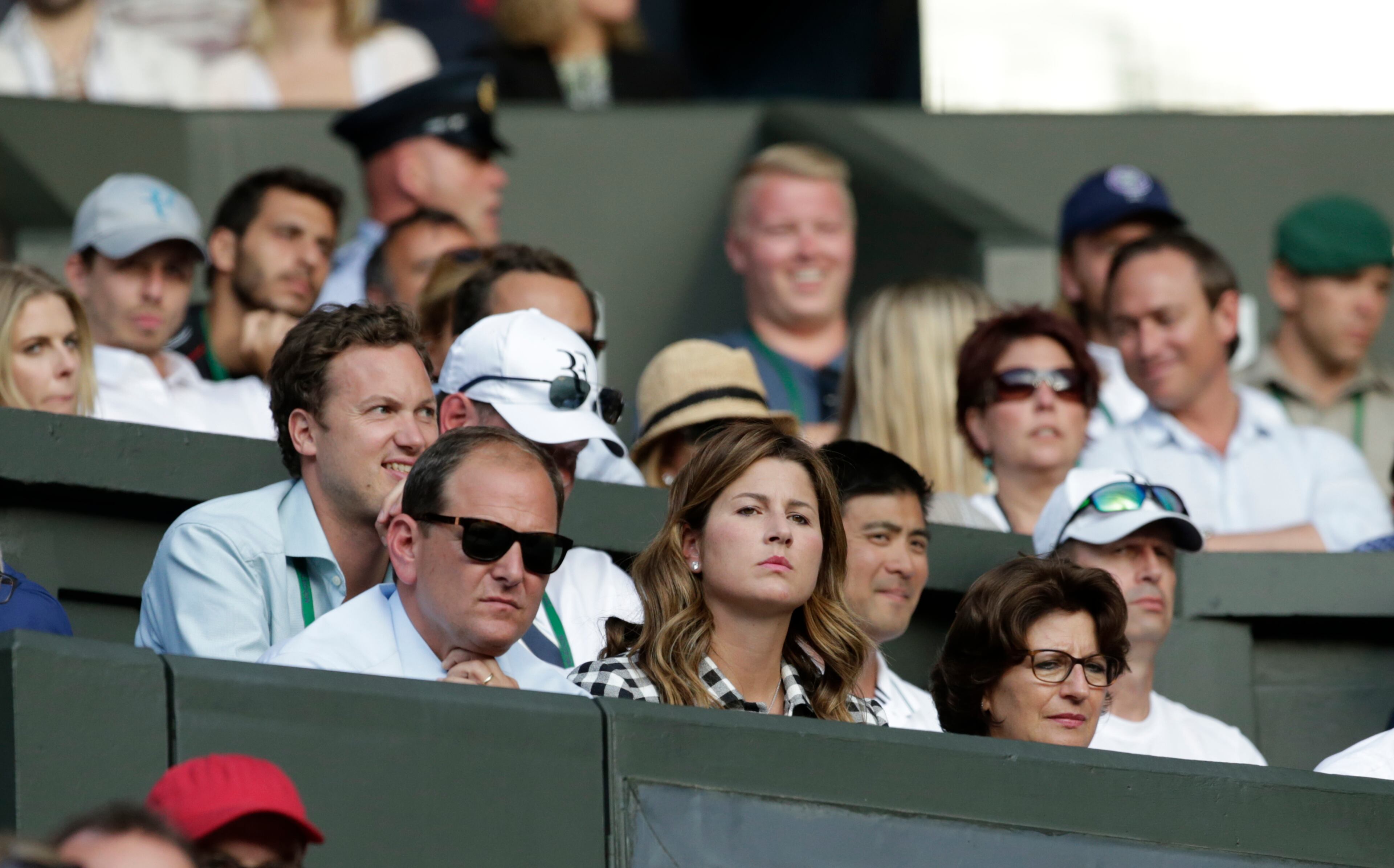 Mirka, centre, the wife Roger Federer of Switzerland watches his singles match against Roberto Bautista Agut of Spain, at the All England Lawn Tennis Championships in Wimbledon, London, Monday July 6, 2015. (AP Photo/Alastair Grant)