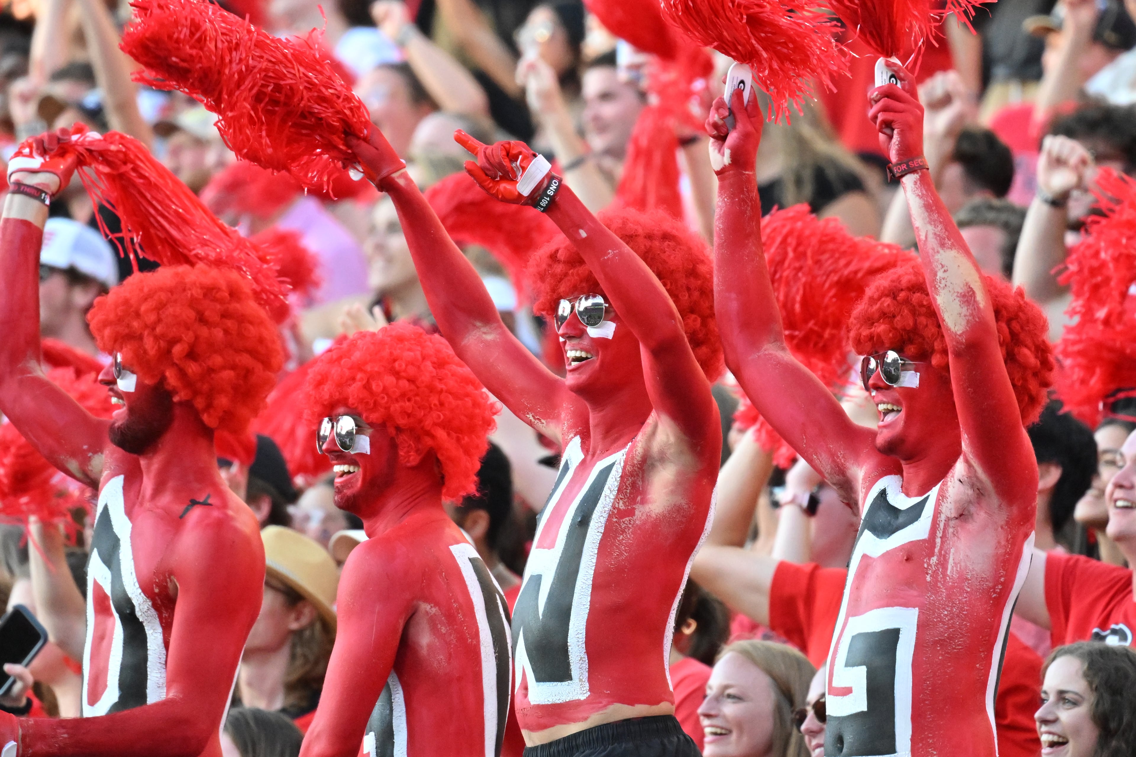 Georgia fans cheer during the second half in a NCAA college football game at Sanford Stadium in Athens on Saturday, October 8, 2022. Georgia won 42-10 over Auburn. (Hyosub Shin / Hyosub.Shin@ajc.com)