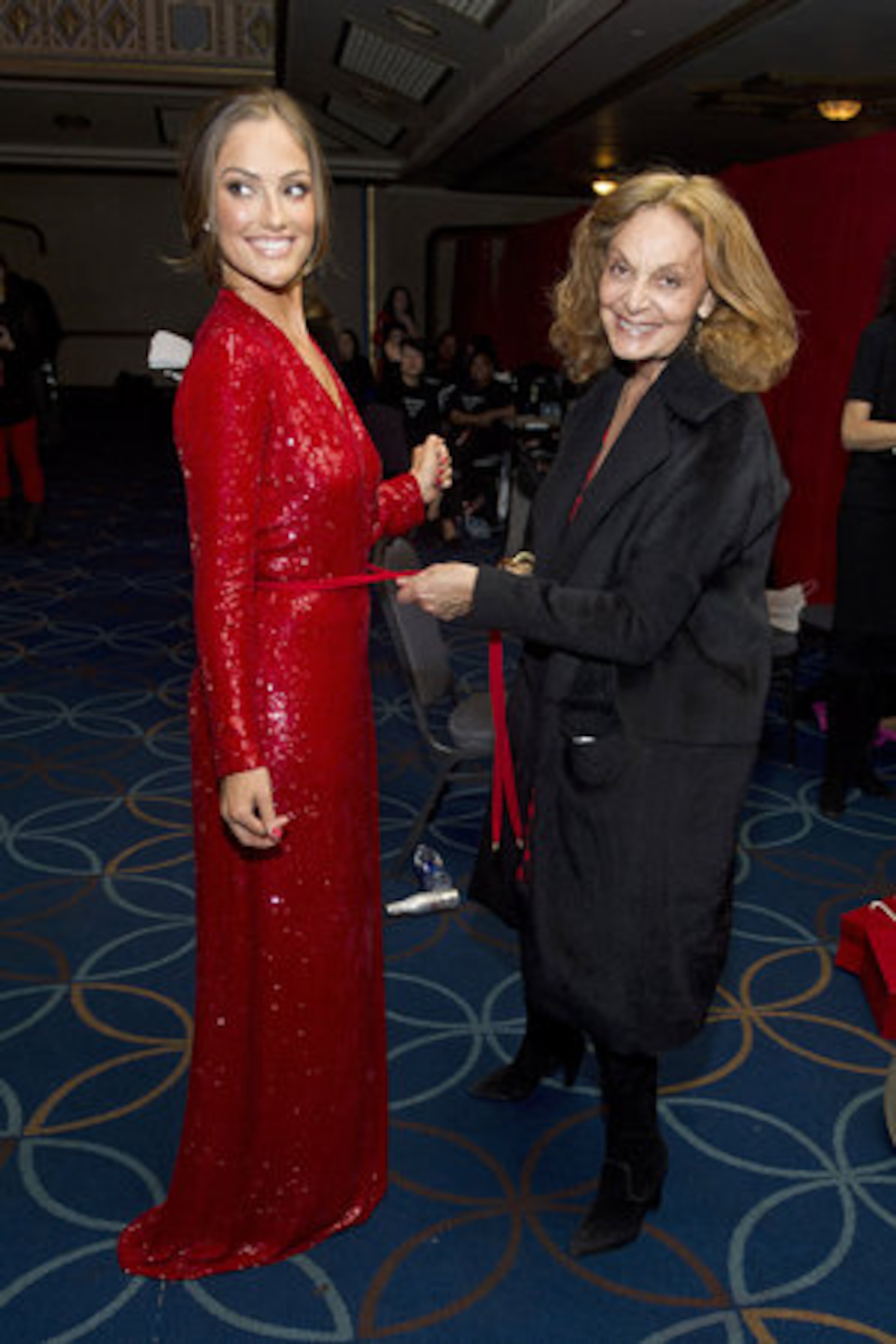 Minka Kelly, left, and designer Diane von Furstenberg appear backstage at the Heart Truth's Red Dress Collection during Fashion Week.