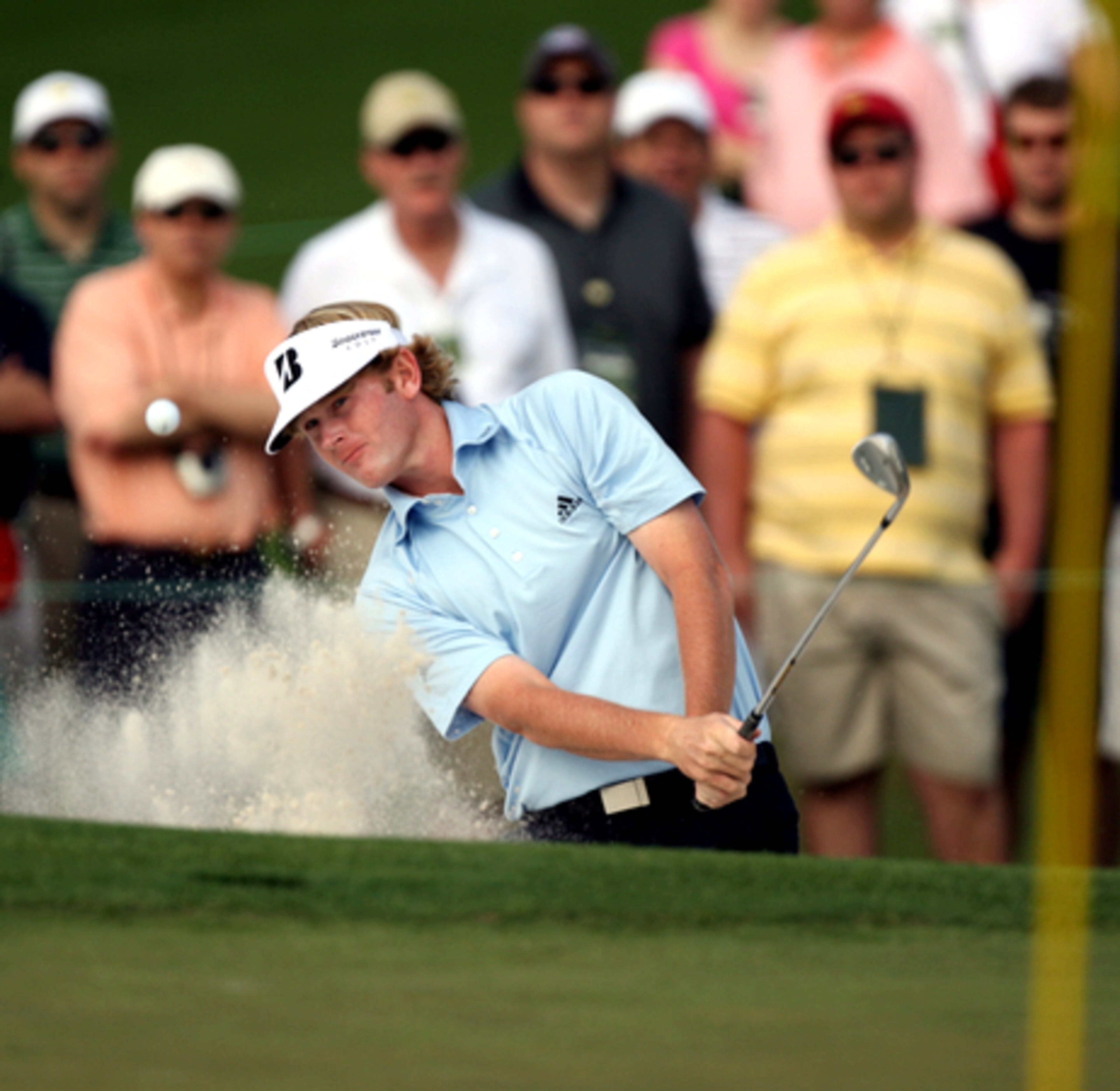 Brandt Snedeker hits out of the bunker on the second hole. Snedeker started the day at 3-under.