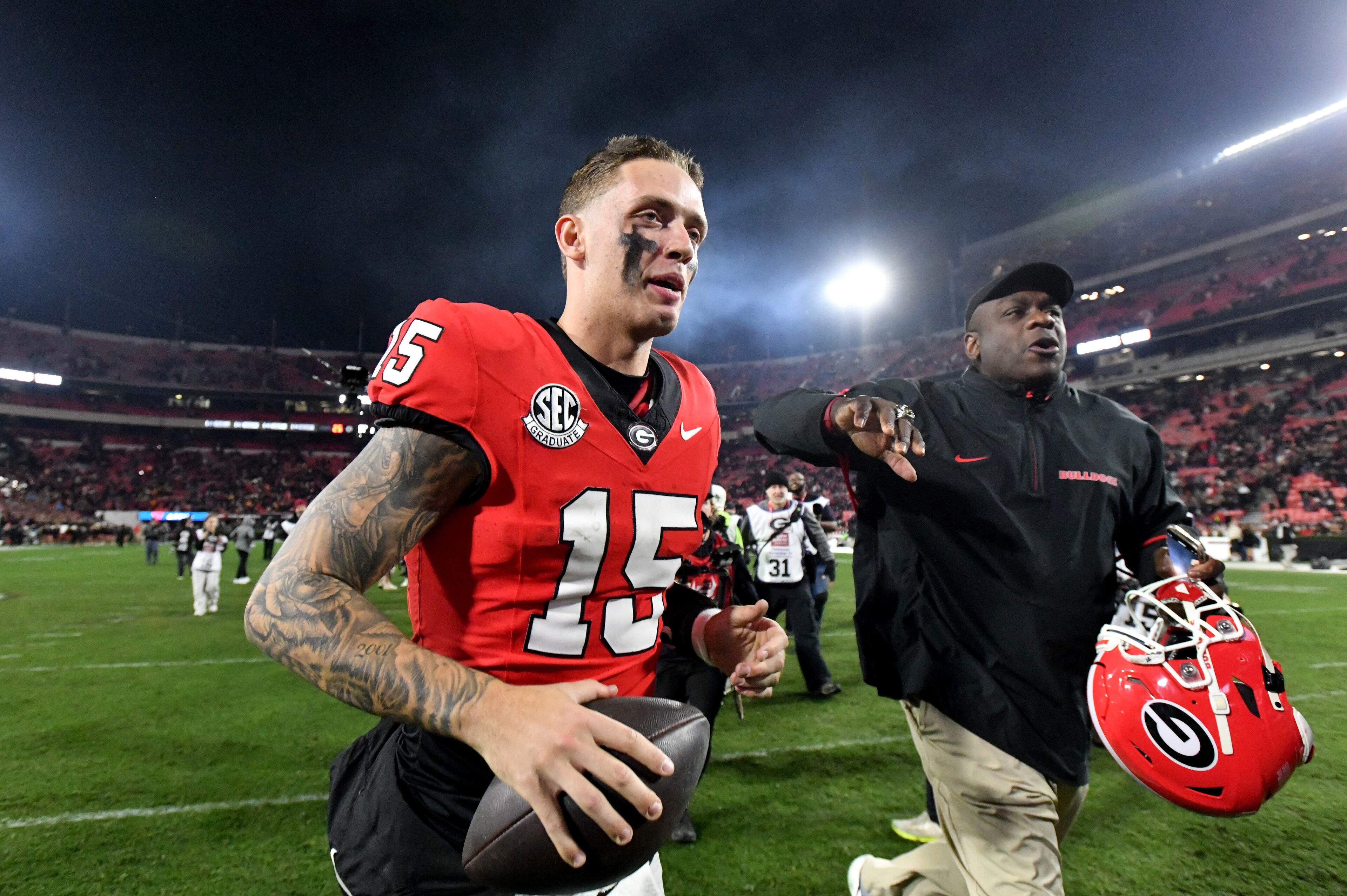 Georgia quarterback Carson Beck (15) leaves the football field after Georgia beat Tennessee in an NCAA football game at Sanford Stadium, Saturday, November 16, 2024, in Athens. Georgia won 31-17 over Tennessee. (Hyosub Shin / AJC)