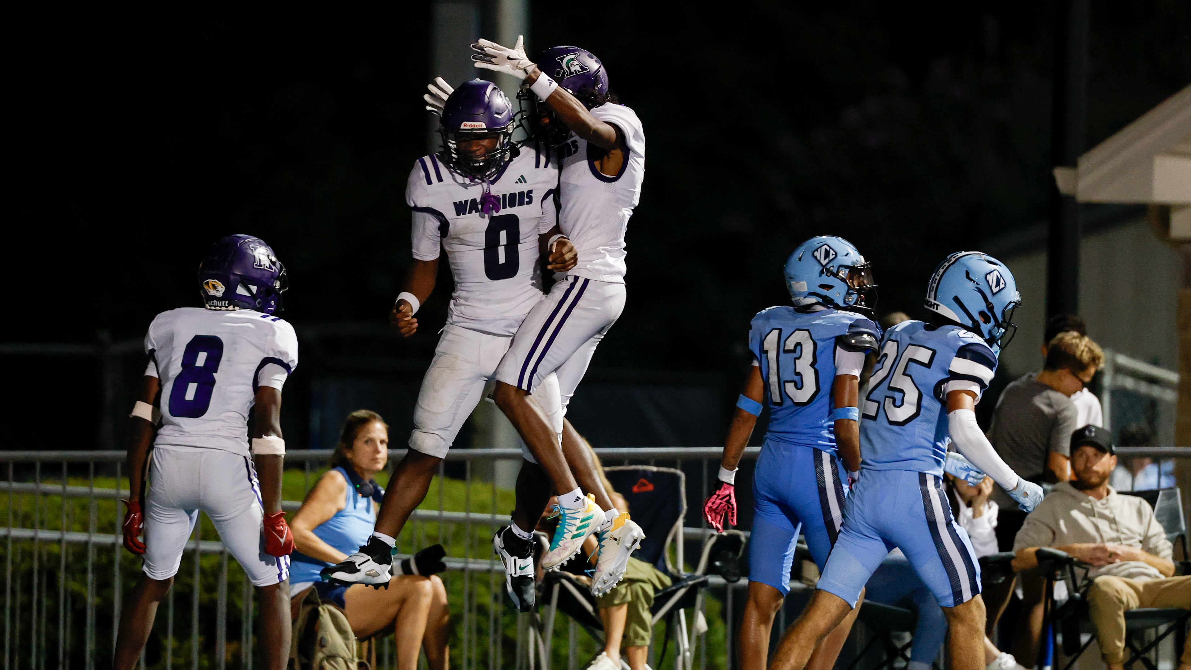 KIPP Atlanta quarterback Dylan Favors (center) celebrates his touchdown with teammates Vincent Lawrence (left) and Tyree Harris during their game against North Cobb Christian on Friday, Oct. 2, 2026, in Kennesaw. (Erik S. Lesser for the AJC)