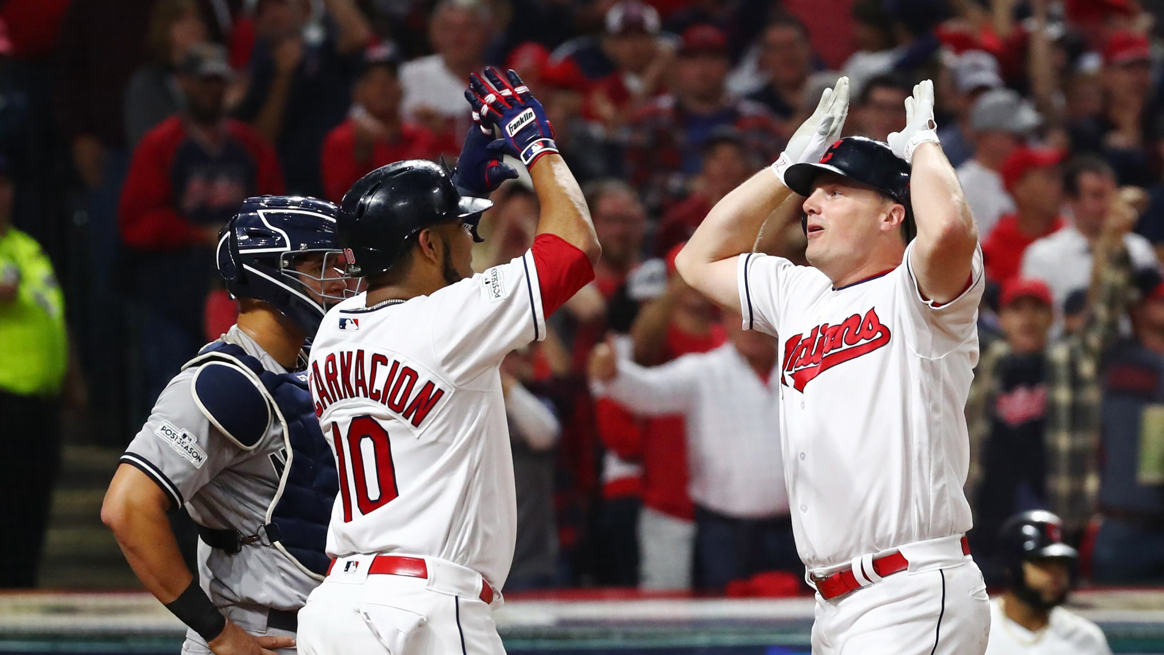 CLEVELAND, OH - OCTOBER 05: Jay Bruce #32 is congratulated by his teammate Edwin Encarnacion #10 of the Cleveland Indians after hitting a two-run home run during the fourth inning against the New York Yankees during game one of the American League Division Series at Progressive Field on October 5, 2017 in Cleveland, Ohio. (Photo by Gregory Shamus/Getty Images)