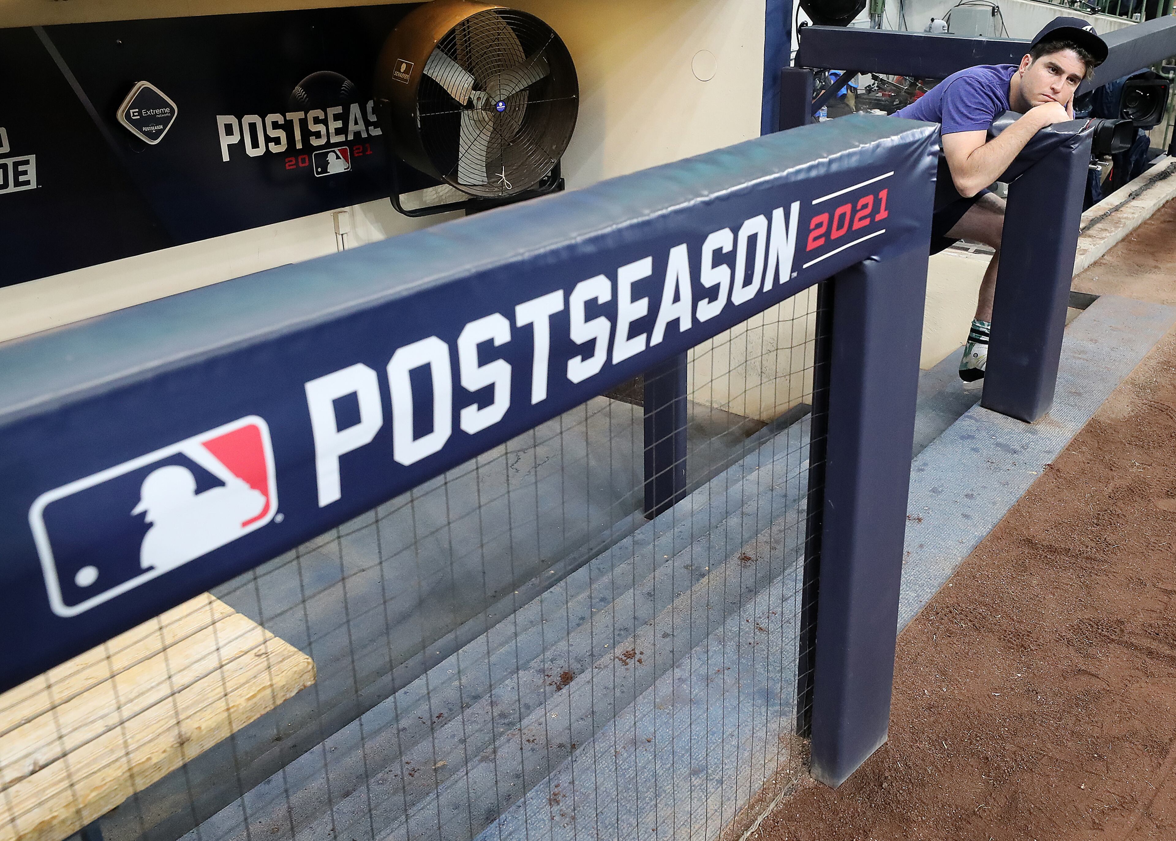 Braves reliever Luke Jackson appears relaxed taking in American Family Field from the dugout during team practice for the opening game of the National League Division Series at American Family Field on Thursday, Oct. 7, 2021, in Milwaukee. “Curtis Compton / Curtis.Compton@ajc.com”