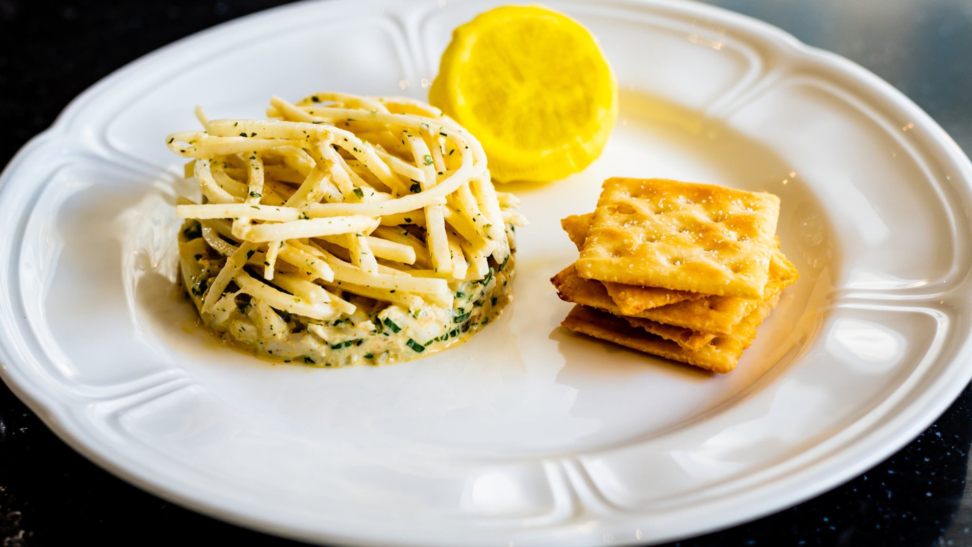An appetizer of blue crab comes with house-made saltines at By George. CONTRIBUTED BY HENRI HOLLIS