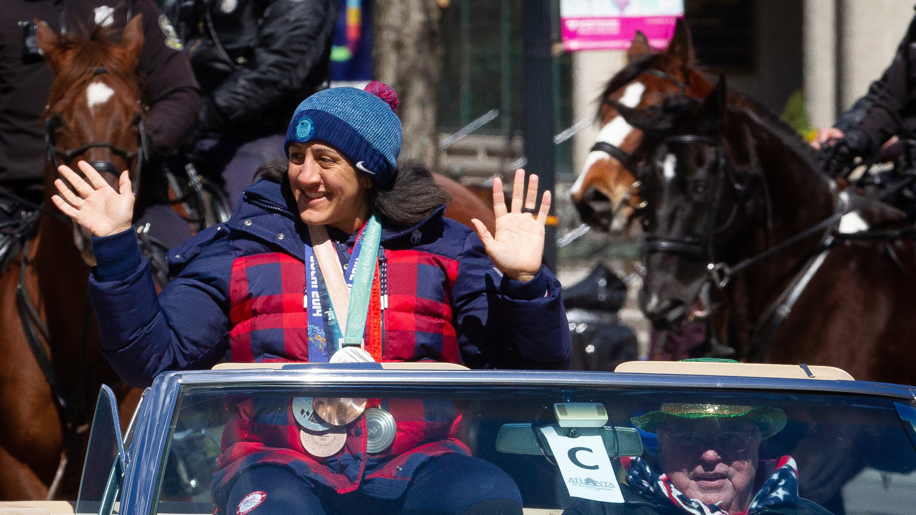 Honorary grand marshal and Olympic medalist Elana Meyers Taylor waves to the crowd during the Atlanta St. Patrick's Parade in Midtown on Saturday, March 12, 2022. (Photo by Steve Schaefer for The Atlanta Journal-Constitution)