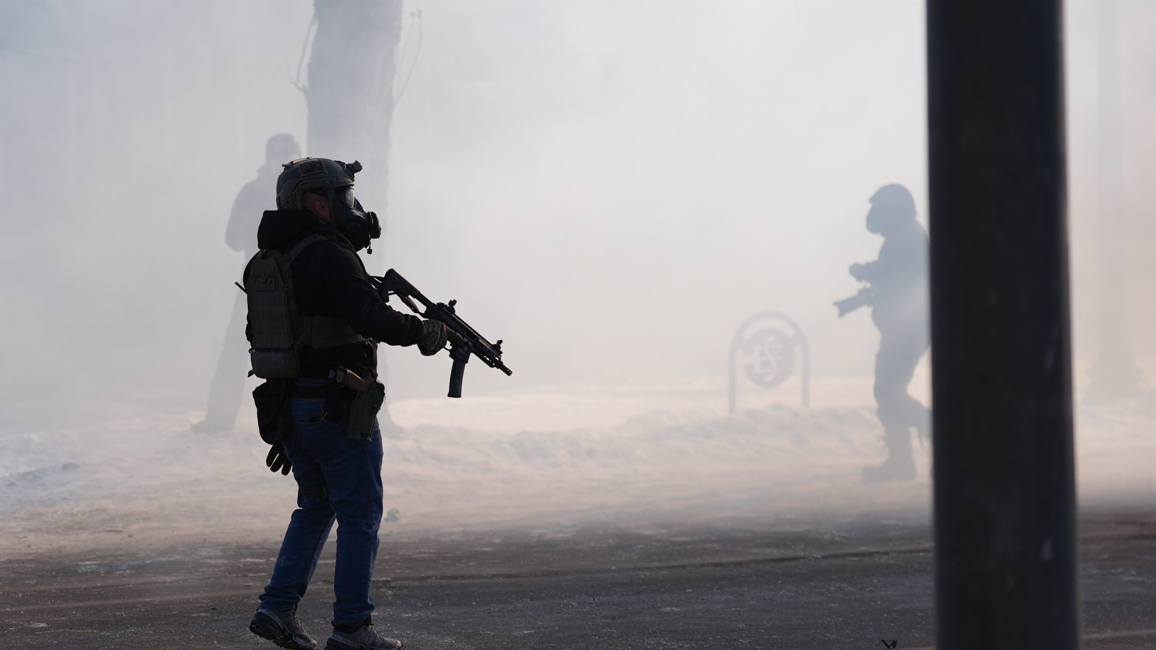 Federal immigration officers deploy tear gas after a shooting in Minneapolis, on Saturday, Jan. 24, 2026. (AP Photo/Abbie Parr)