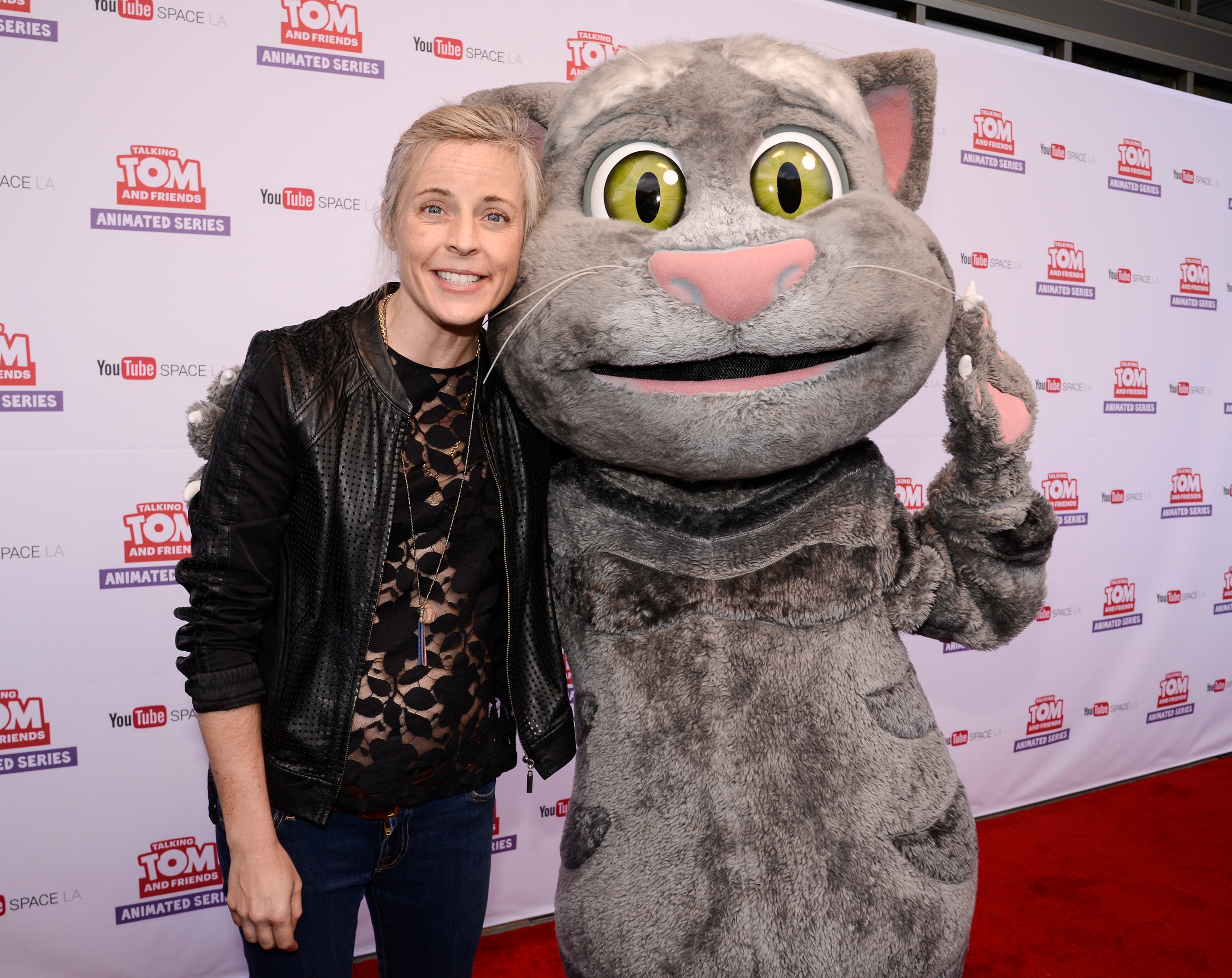Comedian Maria Bamford (left) and Talking Tom attend the premiere screening of the "Talking Tom and Friends" animated series at YouTube Space LA on Thursday, April 30, 2015, in Los Angeles. The series debuts today on YouTube. (Dan Steinberg/AP)
