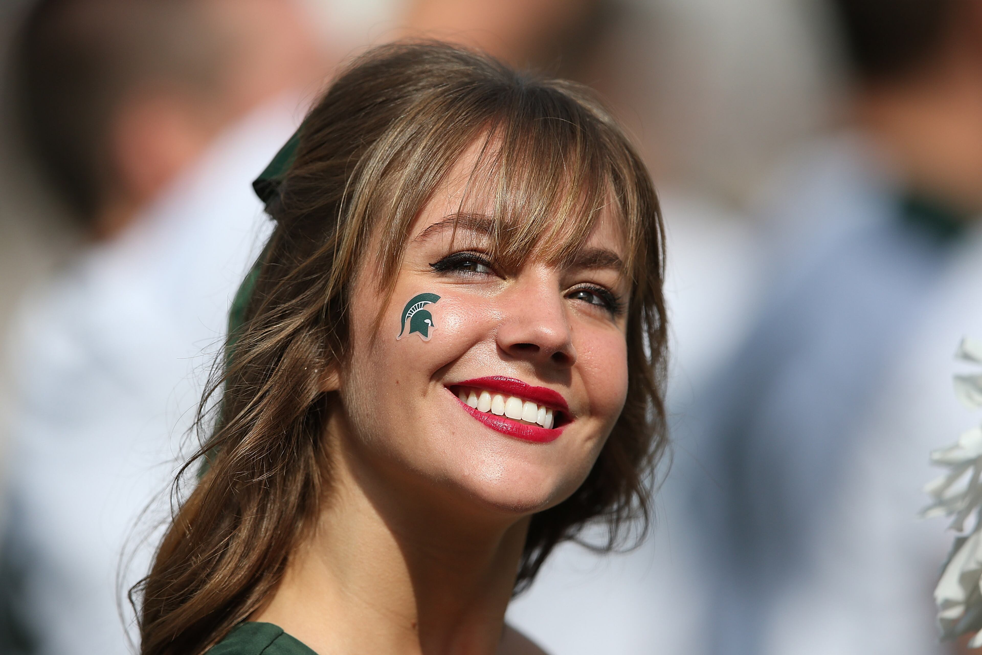 A Michigan State Spartans cheerleader entertains the fans during the game against the Central Michigan Chippewas on September 26, 2015 at Spartan Stadium in East Lansing, Michigan. The Spartans defeated the Chippewas 30-10. (Photo by Leon Halip/Getty Images)