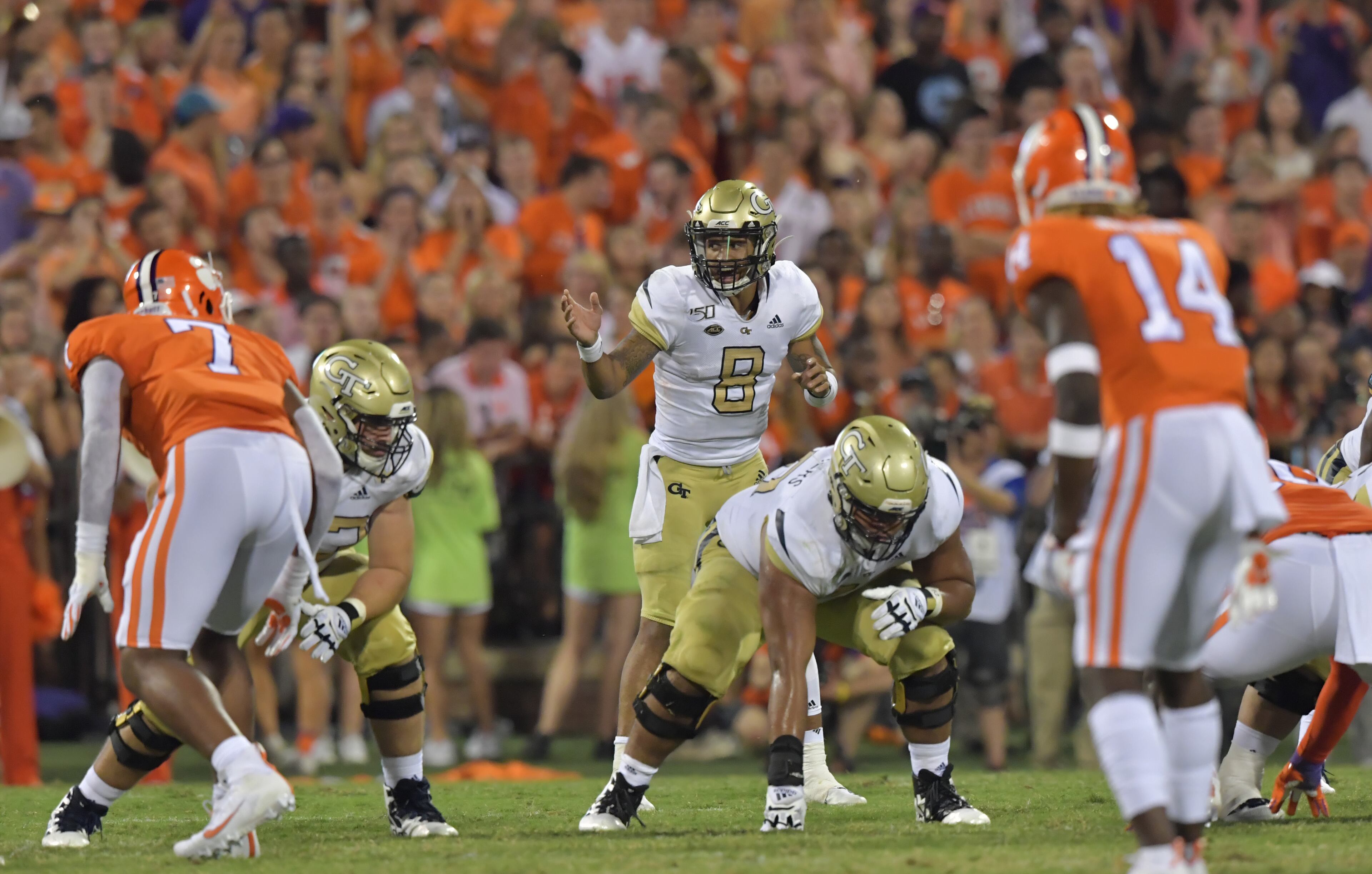 Georgia Tech quarterback Tobias Oliver (8) shouts instructions in the first half at Memorial Stadium on the Clemson University campus in Clemson, S.C. on Thursday, August 29, 2019. Georgia Tech took the field for the first time with Geoff Collins as head coach. (Hyosub Shin / Hyosub.Shin@ajc.com)