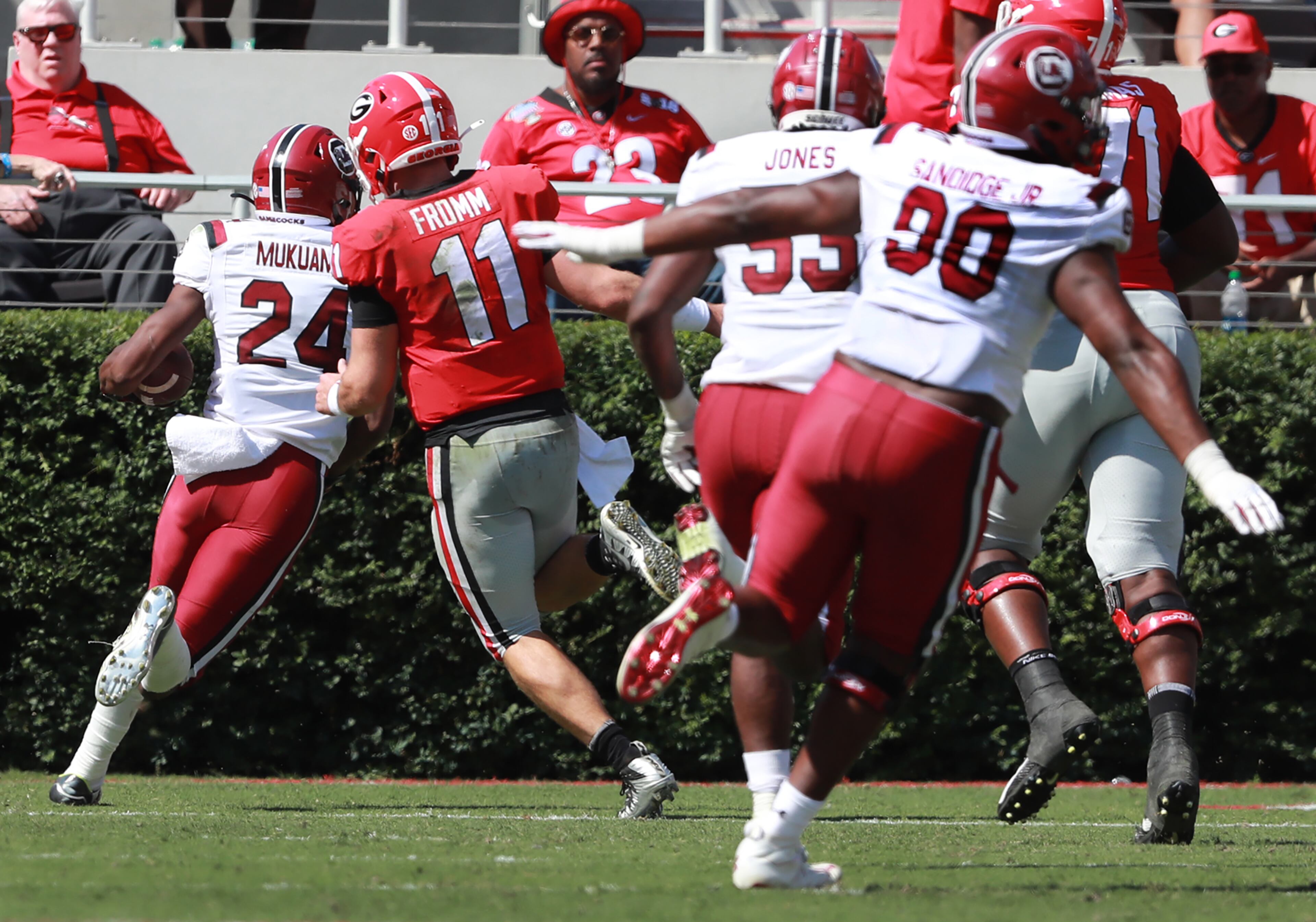 South Carolina defensive back Israel Mukuamu intercepts a Jake Fromm pass to Georgia wide receiver George Pickens and returns it for a touchdown past Fromm. Curtis Compton/ccompton@ajc.com