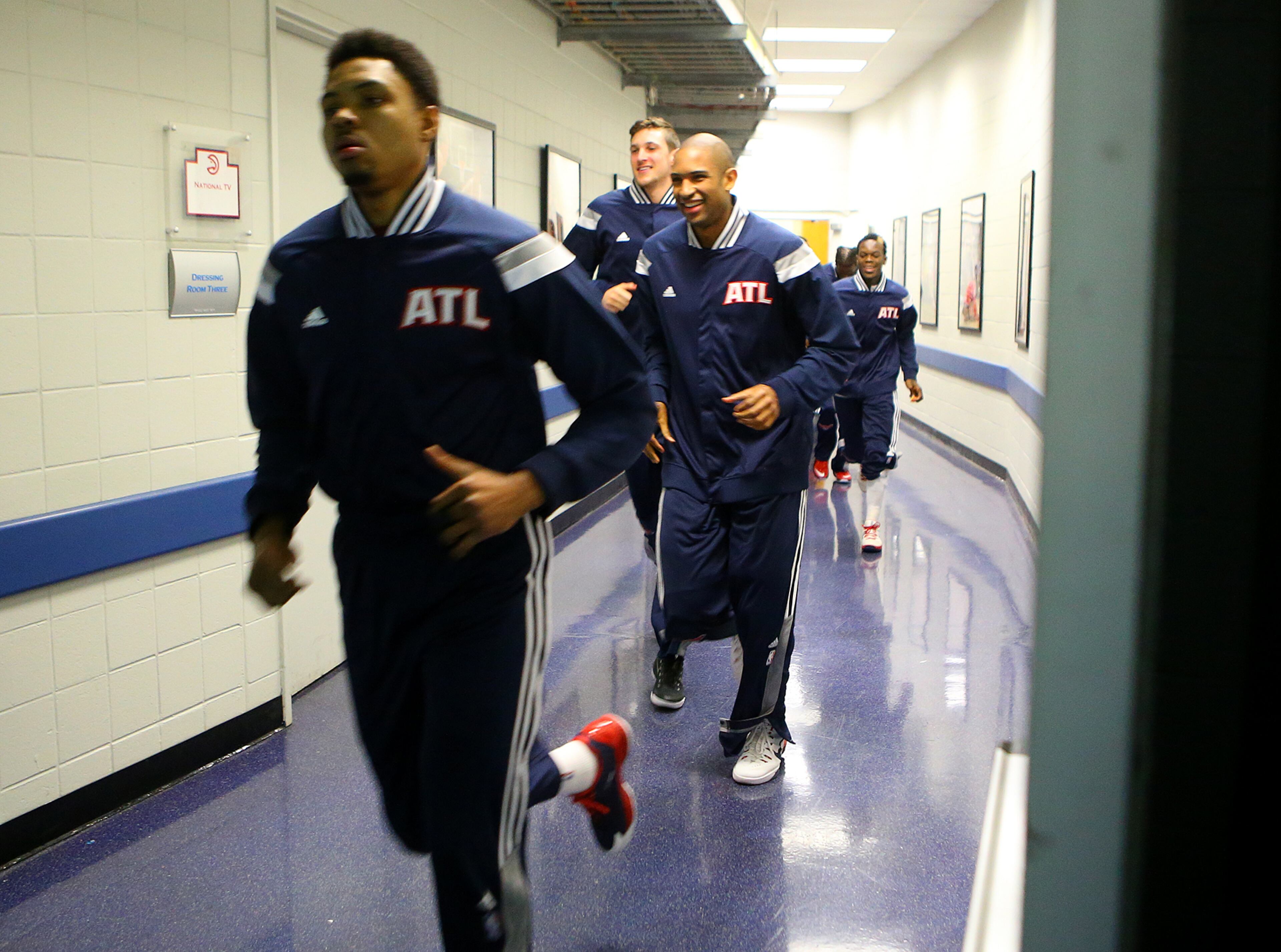 Kent Bazemore and Al Horford lead the Hawks from the locker room to play the Wizards in their Eastern Conference Semifinals game 5 on Tuesday, May 13, 2015, in Atlanta. Curtis Compton / ccompton@ajc.com