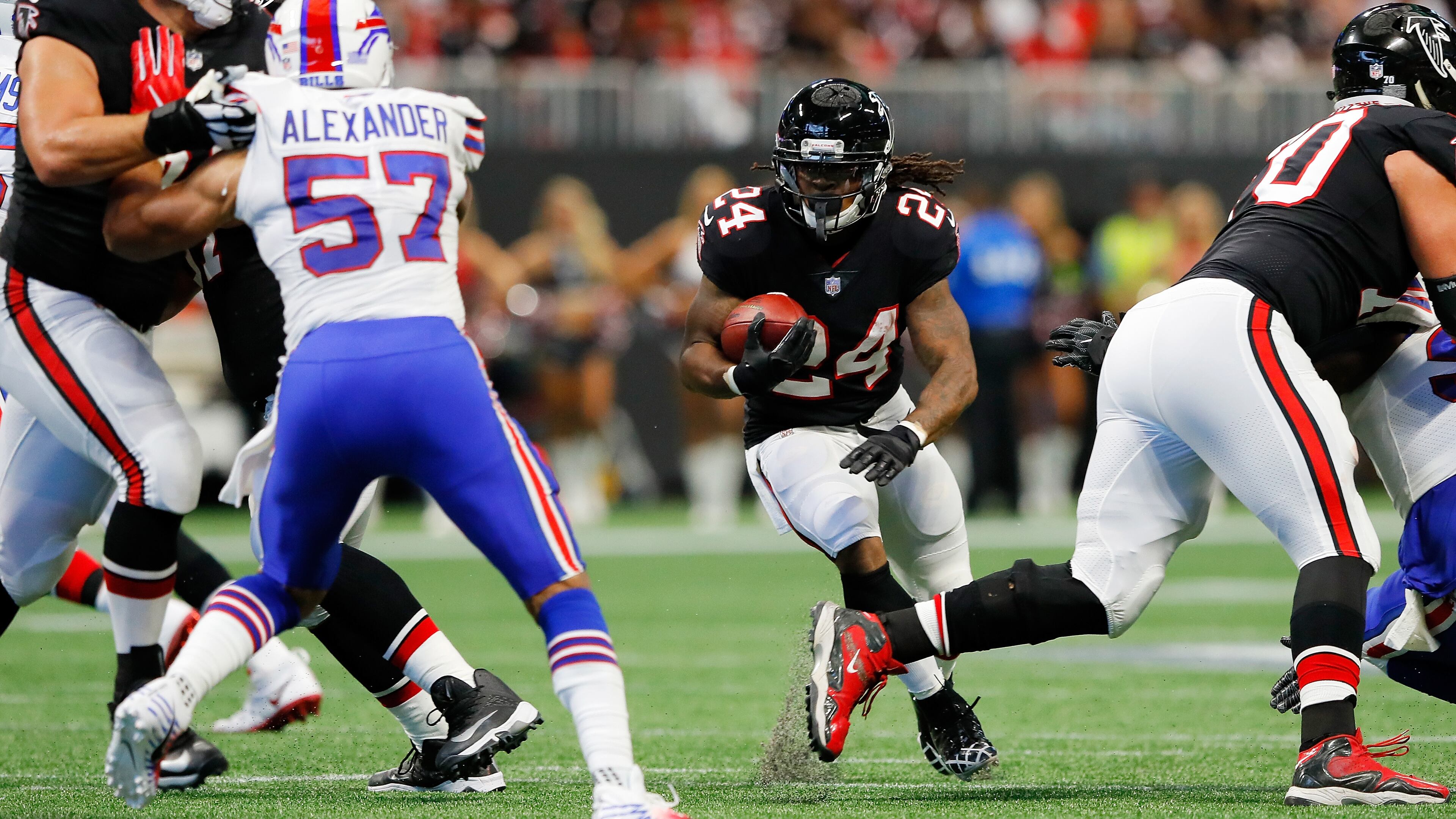 ATLANTA, GA - OCTOBER 01: Devonta Freeman #24 of the Atlanta Falcons runs the ball during the first half against the Buffalo Bills at Mercedes-Benz Stadium on October 1, 2017 in Atlanta, Georgia. (Photo by Kevin C. Cox/Getty Images)