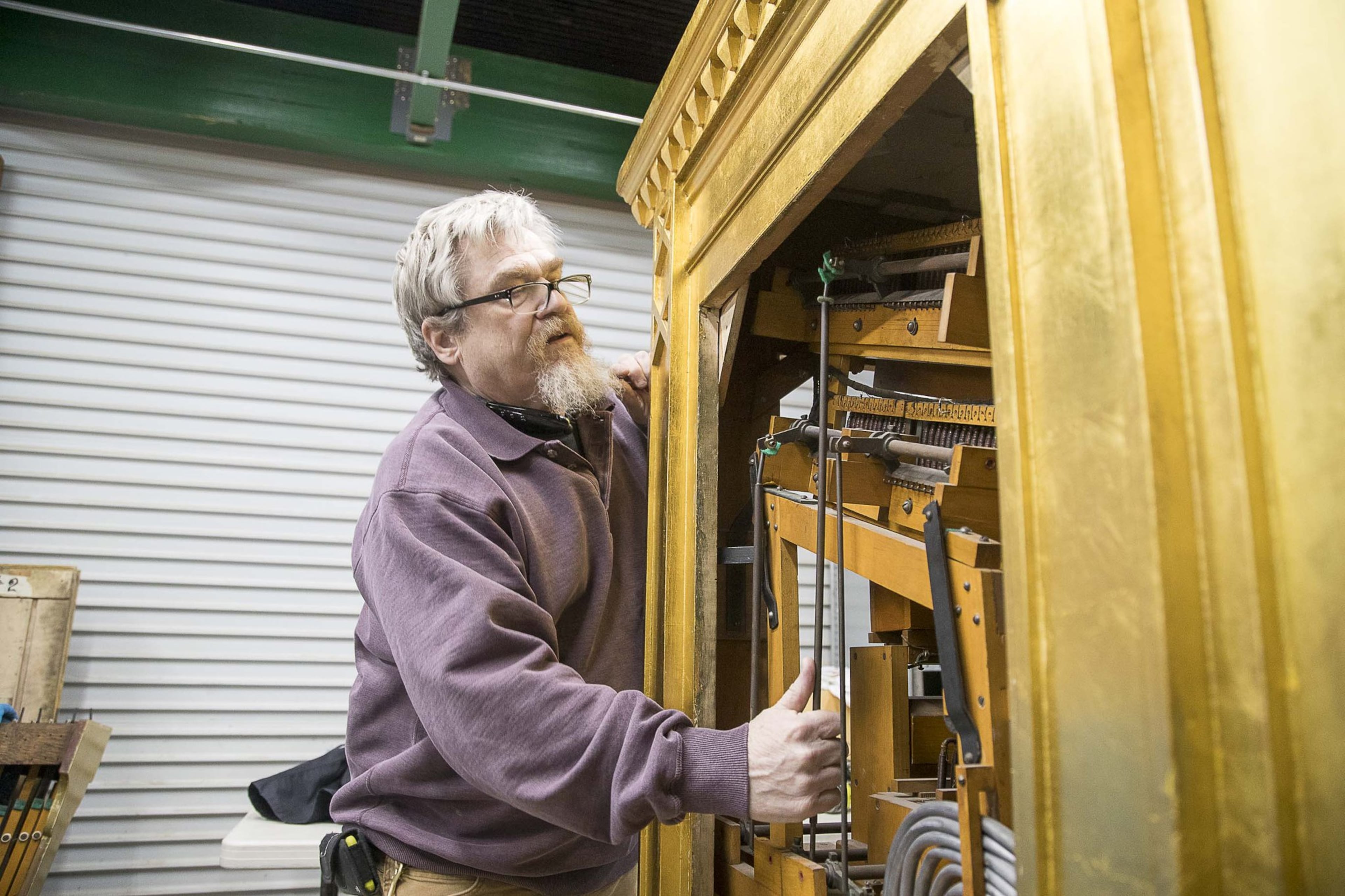 Marc Conley worked for the late Joe Patten, the “Phantom of the Fox,” and was on hand in the 1990s the last time the console was lifted from its elevator at the Fox Theatre. Now a production supervisor at Schlueter, Conley was on hand when the Mighty Mo was hoisted again. “I never thought I’d do this twice in one life,” he said. (ALYSSA POINTER/ALYSSA.POINTER@AJC.COM)