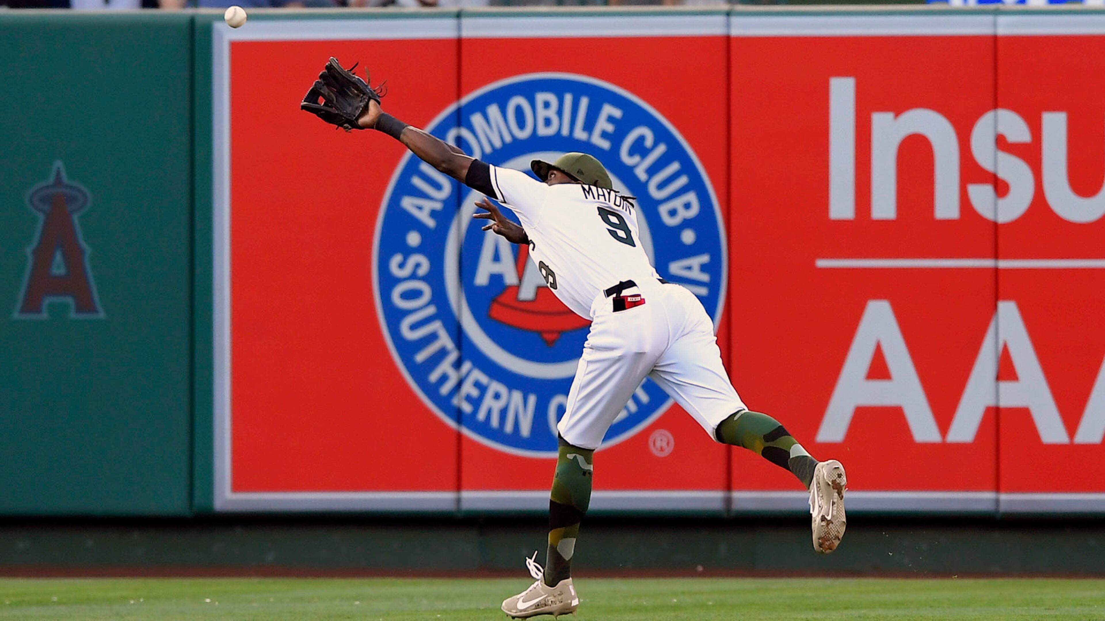 Los Angeles Angels center fielder Cameron Maybin makes a catch on a ball hit by Atlanta Braves' Nick Markakis during the third inning of a baseball game, Monday, May 29, 2017, in Anaheim, Calif. (AP Photo/Mark J. Terrill)