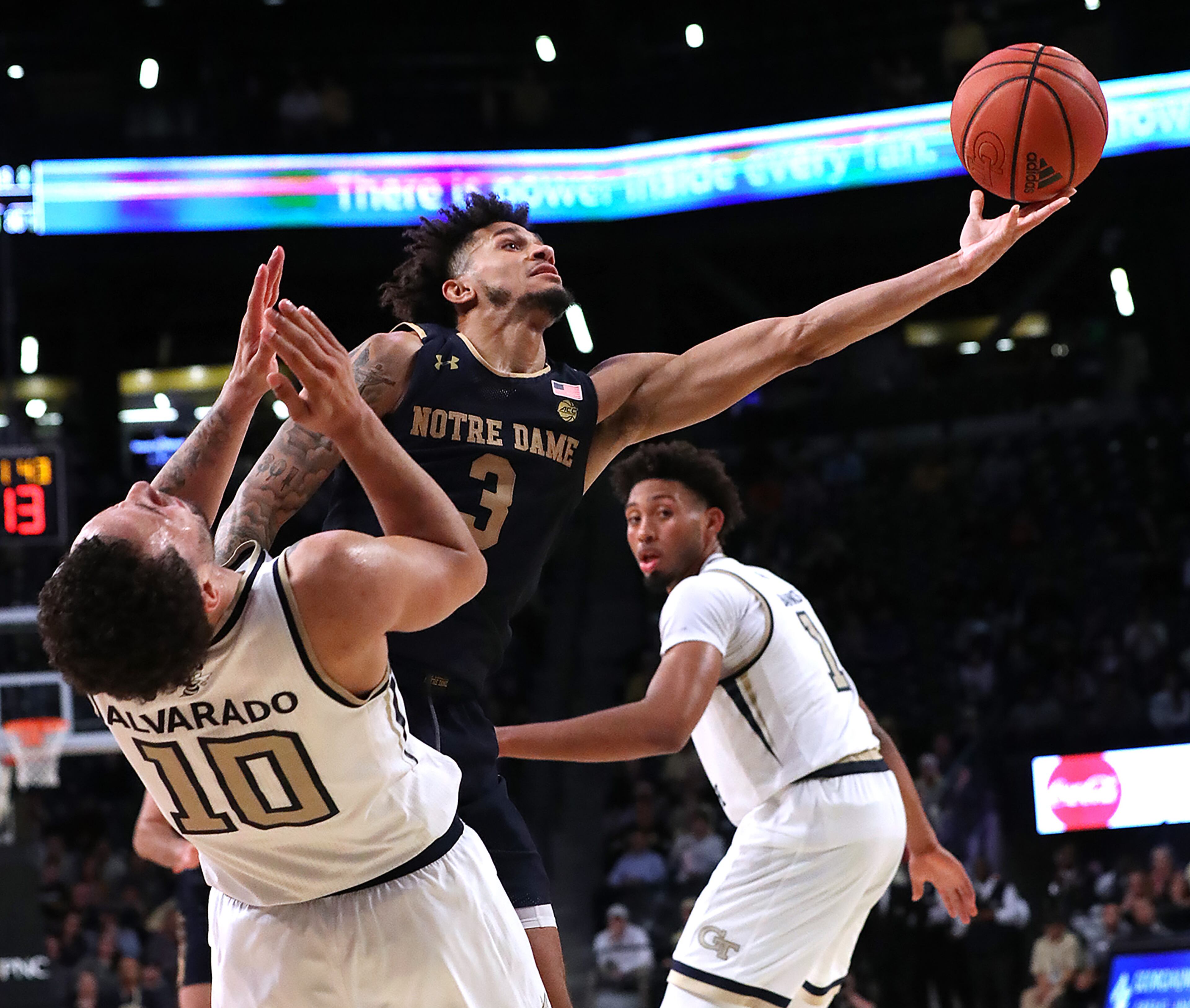Notre Dame guard Prentiss Hubb knocks Georgia Tech guard Jose Alvarado to the hardwood on his way to the basket in the final minutes of a 78-74 Notre Dame victory in a NCAA college basketball game on Wednesday, January 15, 2020, in Atlanta. Curtis Compton ccompton@ajc.com