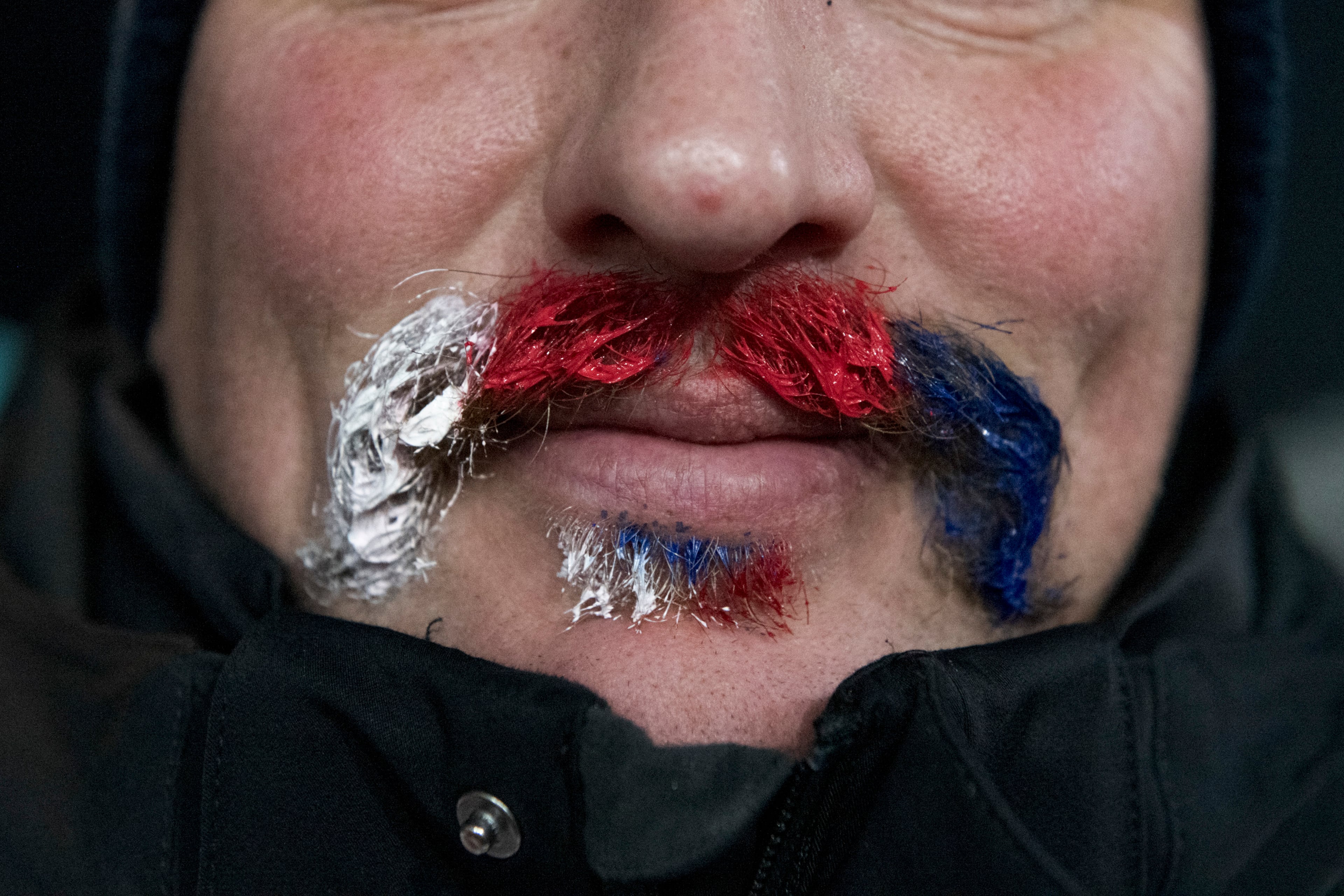 A Czech Republic fan with his mustache dyed in his country's colors during the men's biathlon 10-kilometer sprint during the 2018 Winter Olympics at the Alpensia Biathlon Center in Pyeongchang, South Korea, Feb. 11, 2018. (Hilary Swift/The New York Times)