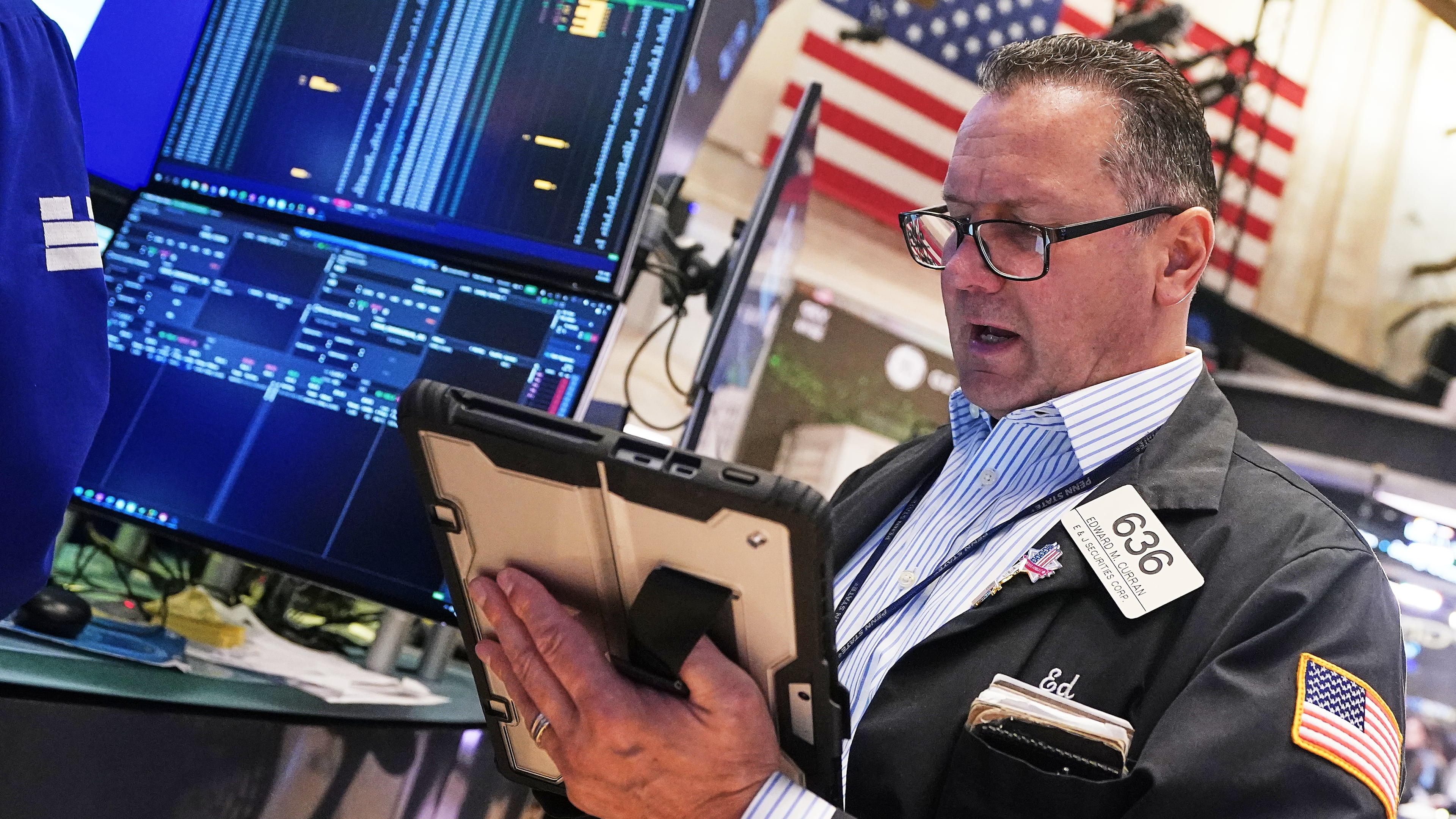 Trader Edward Curran works on the floor of the New York Stock Exchange, Wednesday, April 22, 2026. (AP Photo/Richard Drew)