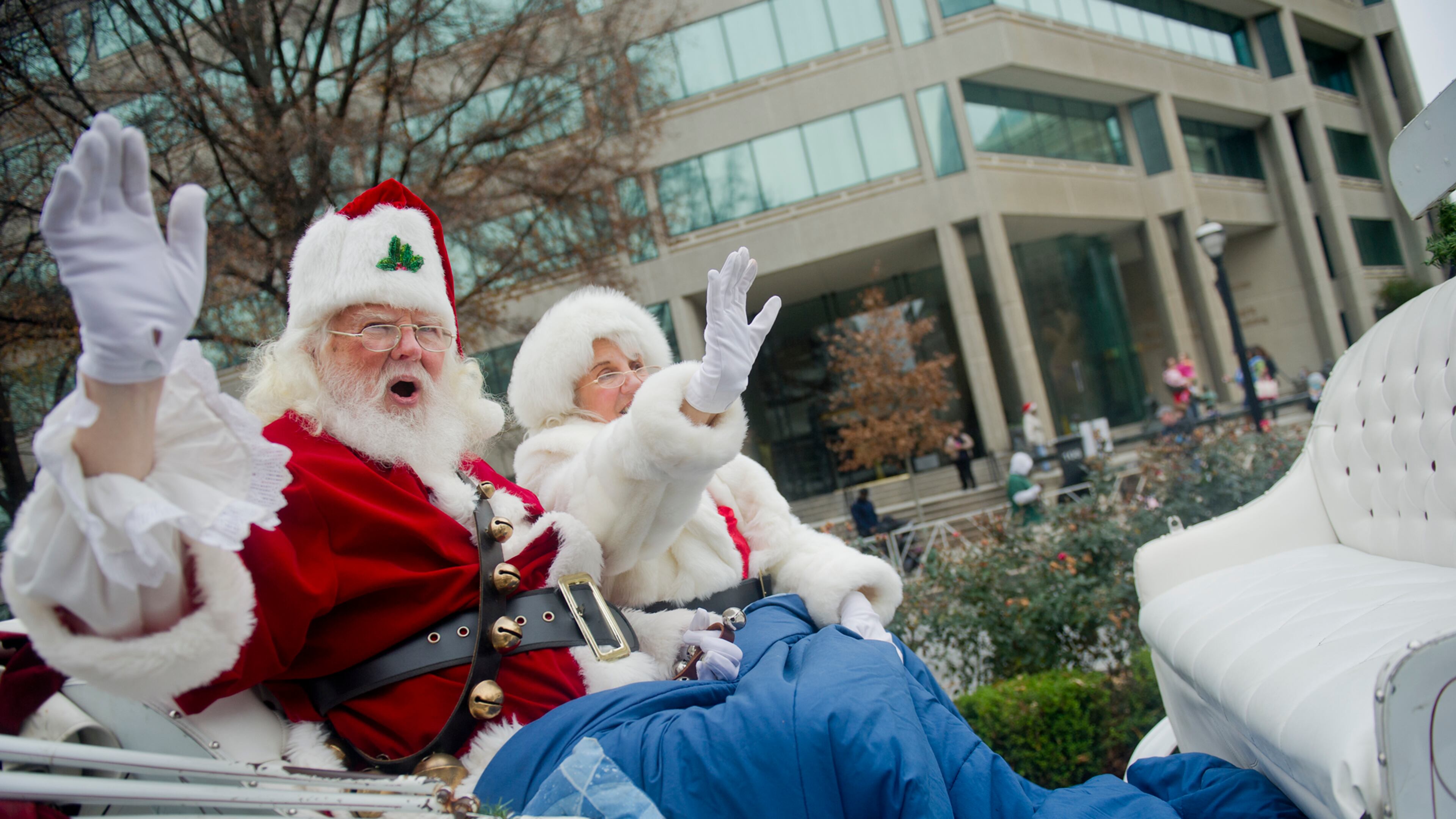 Santa and Mrs. Claus wave to the crowd during the 33rd annual Children's Christmas Parade in Atlanta on Saturday, December 7, 2013. Over 300,000 people were expected to attend the parade that wound its way down Peachtree Street in Midtown. Proceeds from the parade help to fund programs and equipment to serve the patients and families at Children’s Healthcare of Atlanta. JONATHAN PHILLIPS / SPECIAL
