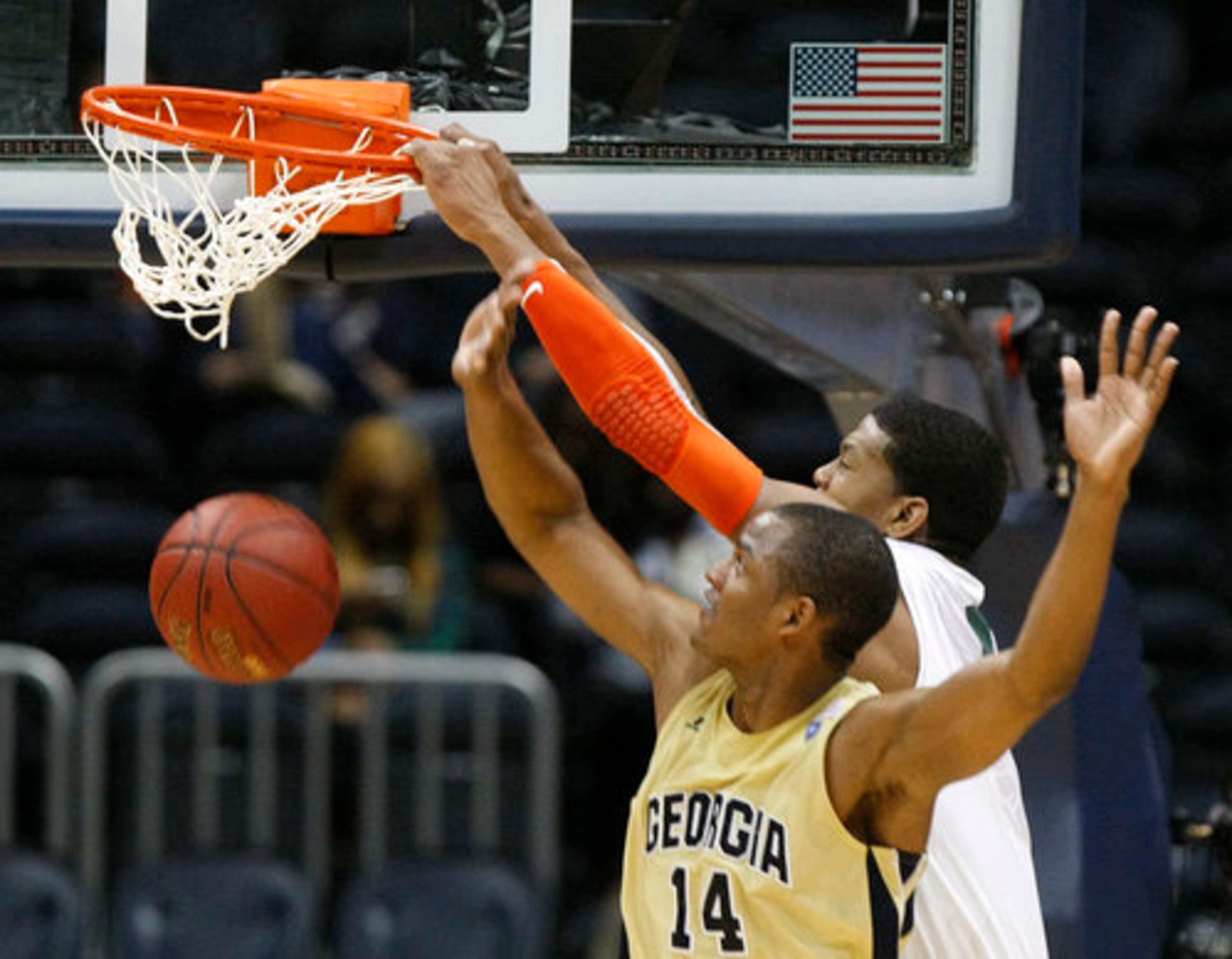 Miami Hurricanes Rion Brown slams over Georgia Tech Yellow Jackets Jason Morris eliminating the Jackets 54-36 in the ACC Tournament, Philips Arena, Thursday, March 8, 2012.