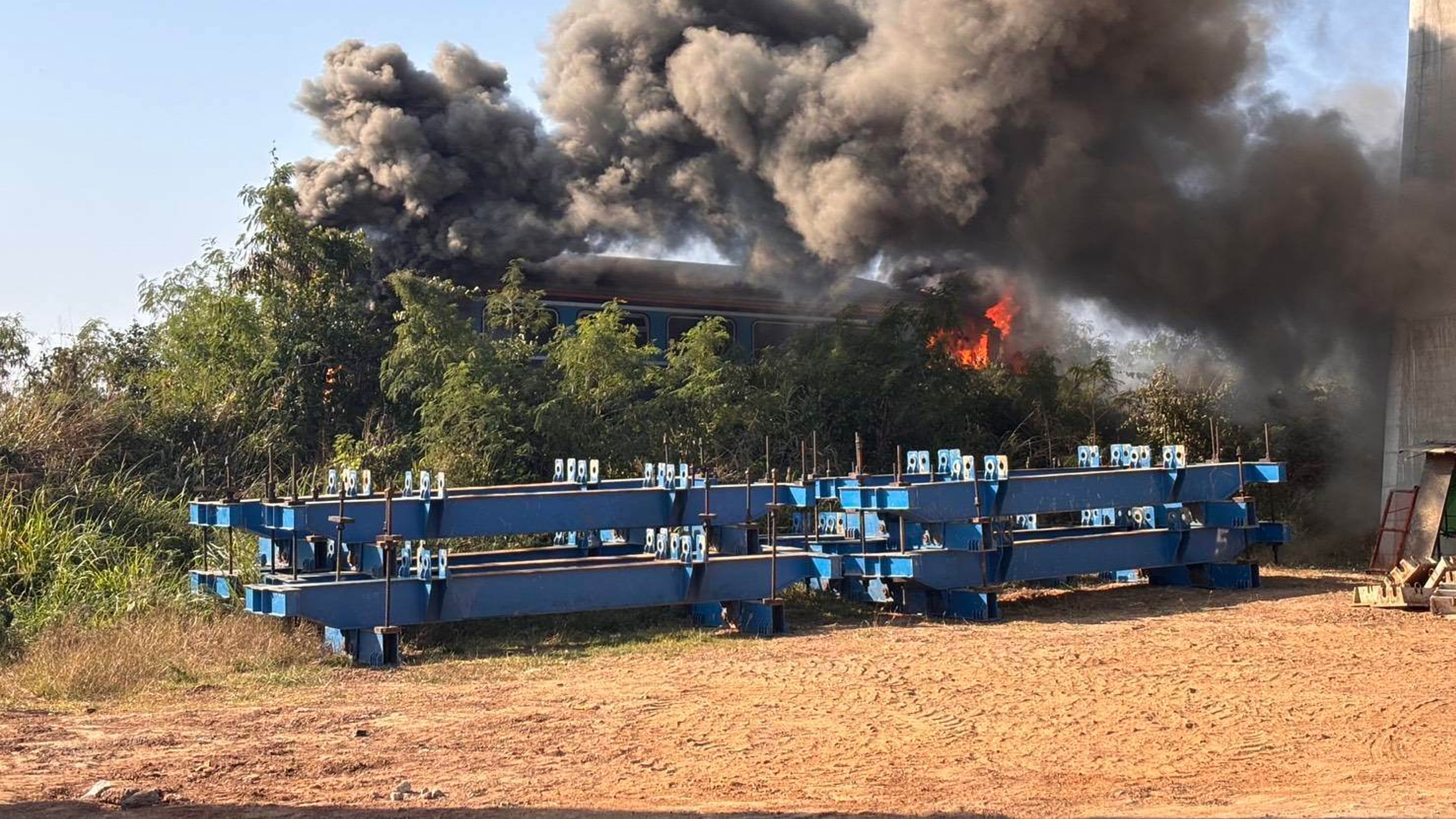 This photo released from Thailand's Ministry of Transport, shows a scene after a construction crane fell into a passenger train in Nakhon Ratchasima province, Thailand Wednesday, Jan. 14, 2026. (Ministry of Transport via AP)