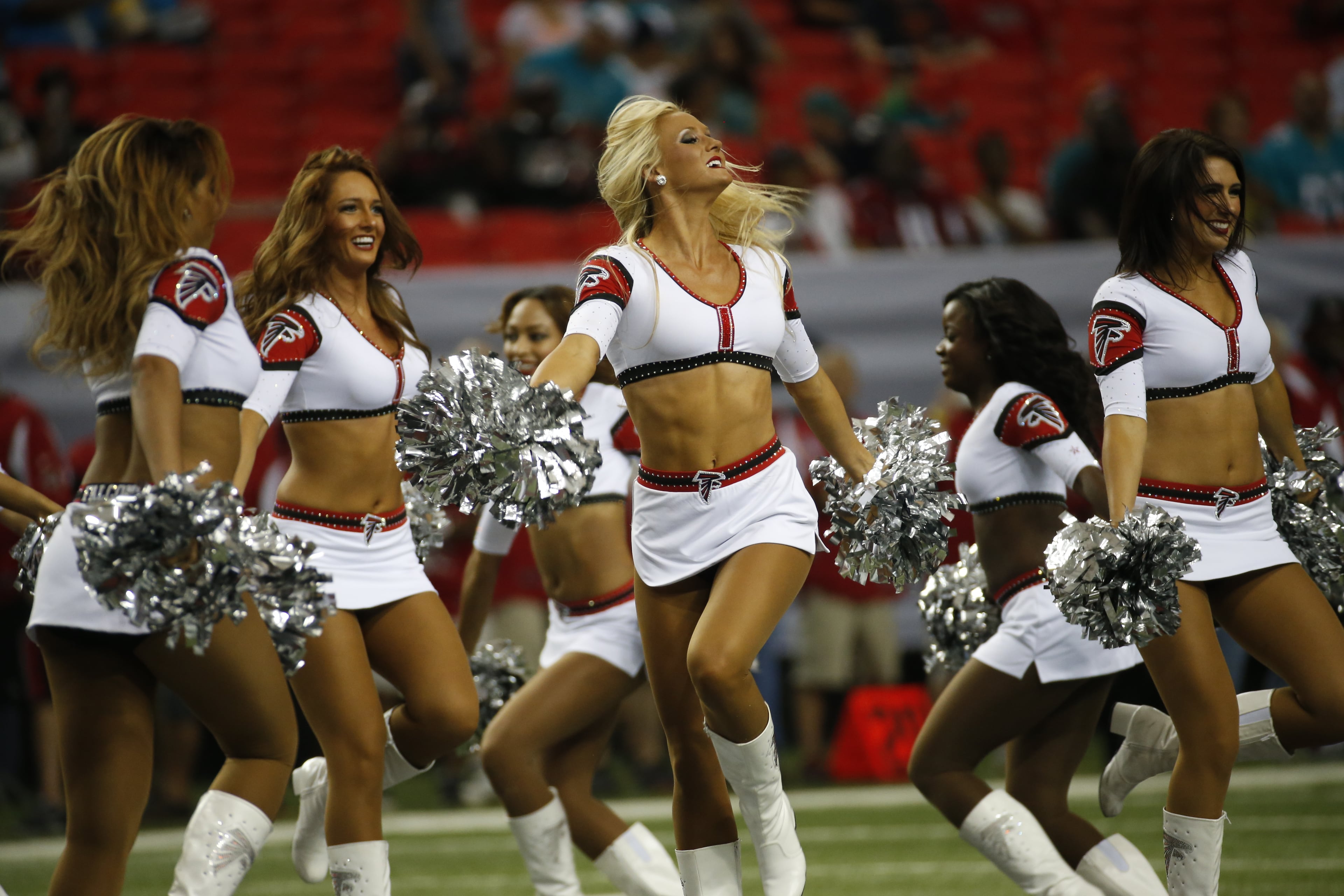 Atlanta Falcons cheerleaders perform before the first half of an NFL preseason football game against the Miami Dolphins, Friday, Aug. 8, 2014, in Atlanta. (AP Photo/John Bazemore)