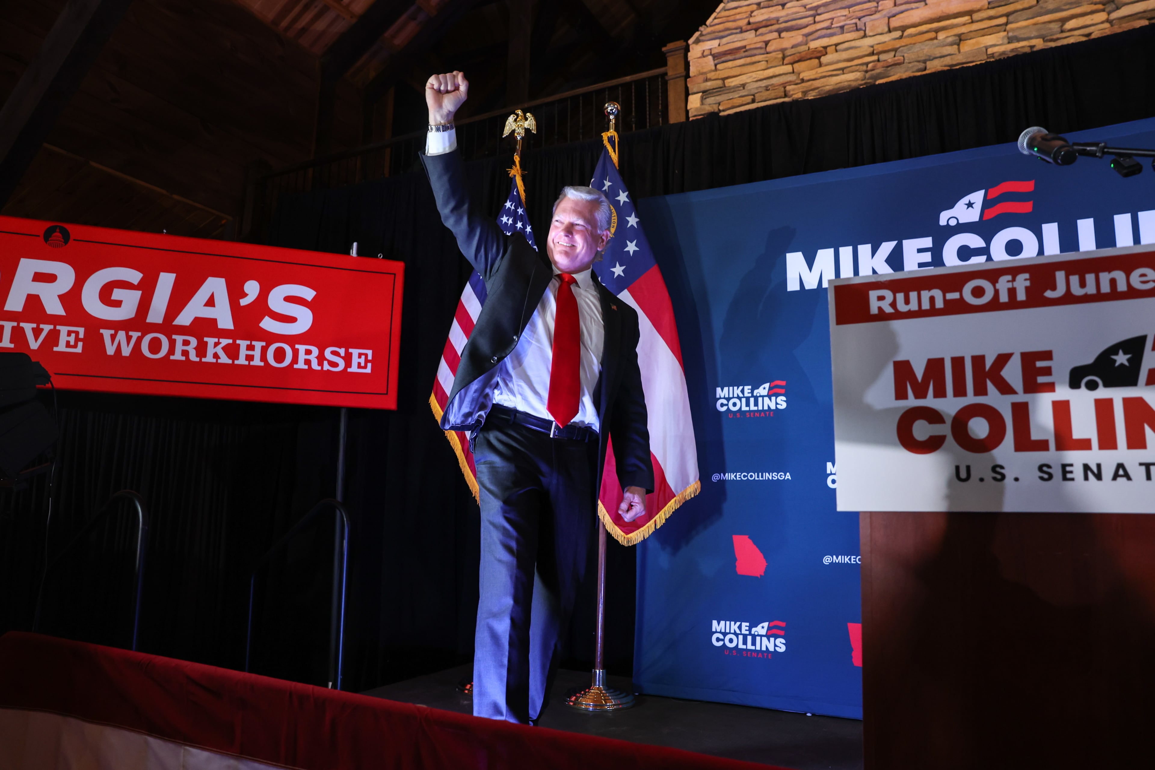 U.S. Rep. Mike Collins takes the stage at his primary election watch party in Jackson last month. (Arvin Temkar/AJC)